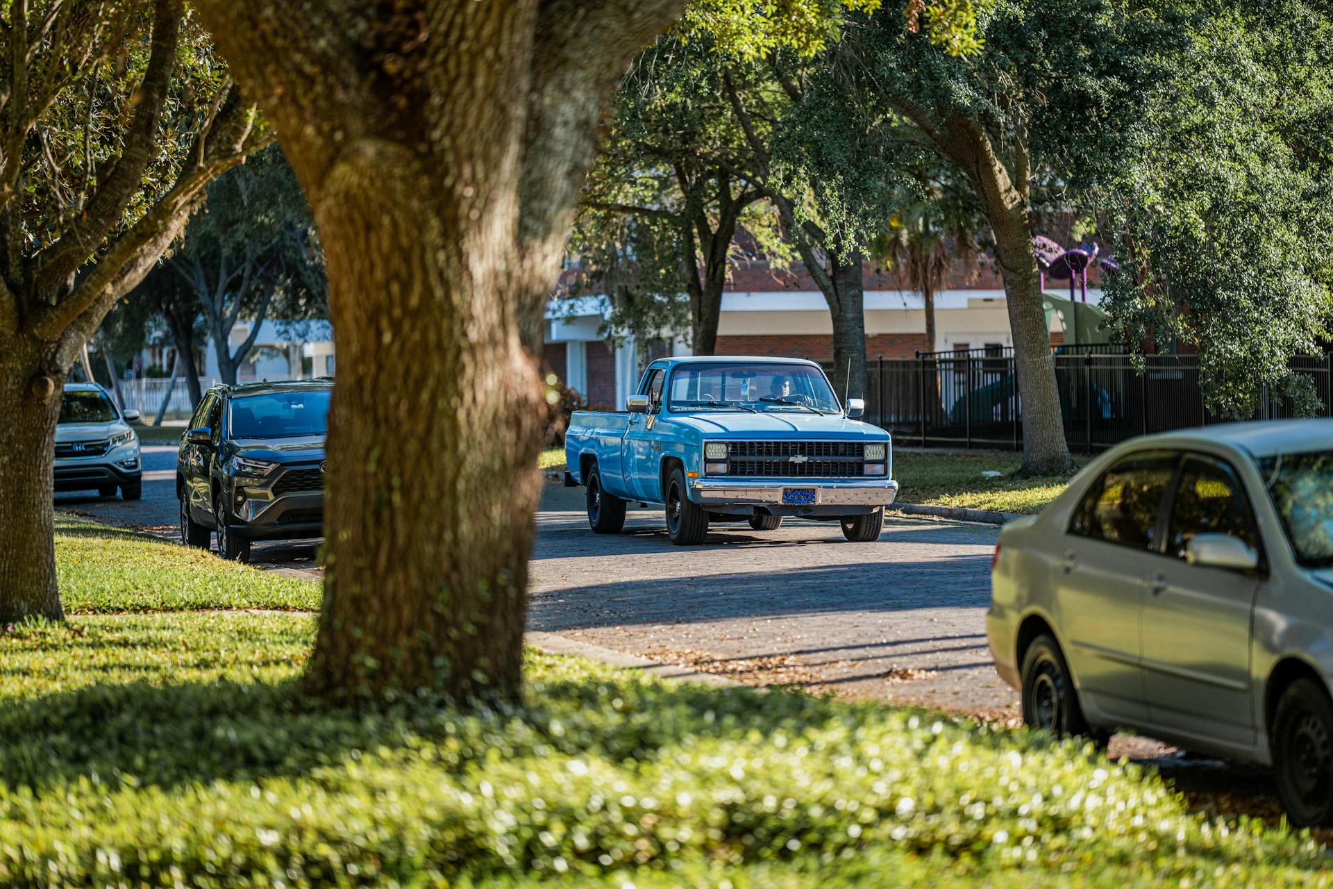 A car driving on a suburban street | Source: Pexels