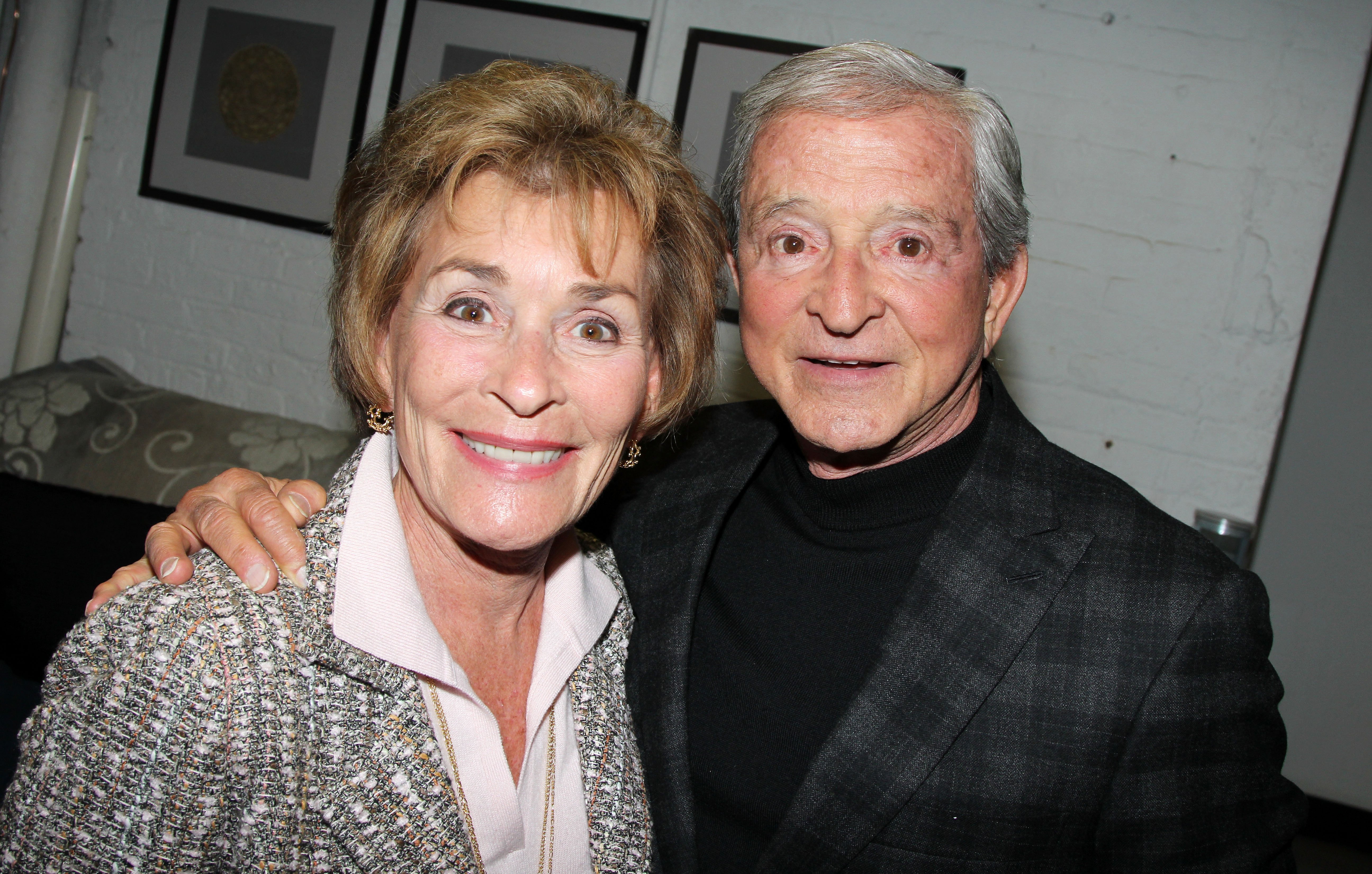Judith "Judge Judy" Sheindlin and husband Judge Jerry Sheindlin pose backstage at the hit comedy "The Performers" on Broadway at The Longacre Theater on November 10, 2012 in New York City. | Source: Getty Images