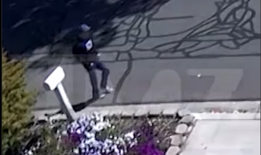 The man labeled a person of interest as captured by security footage walking towards the campus, dated September 12, 2025 | Source: Instagram/tmz_tv