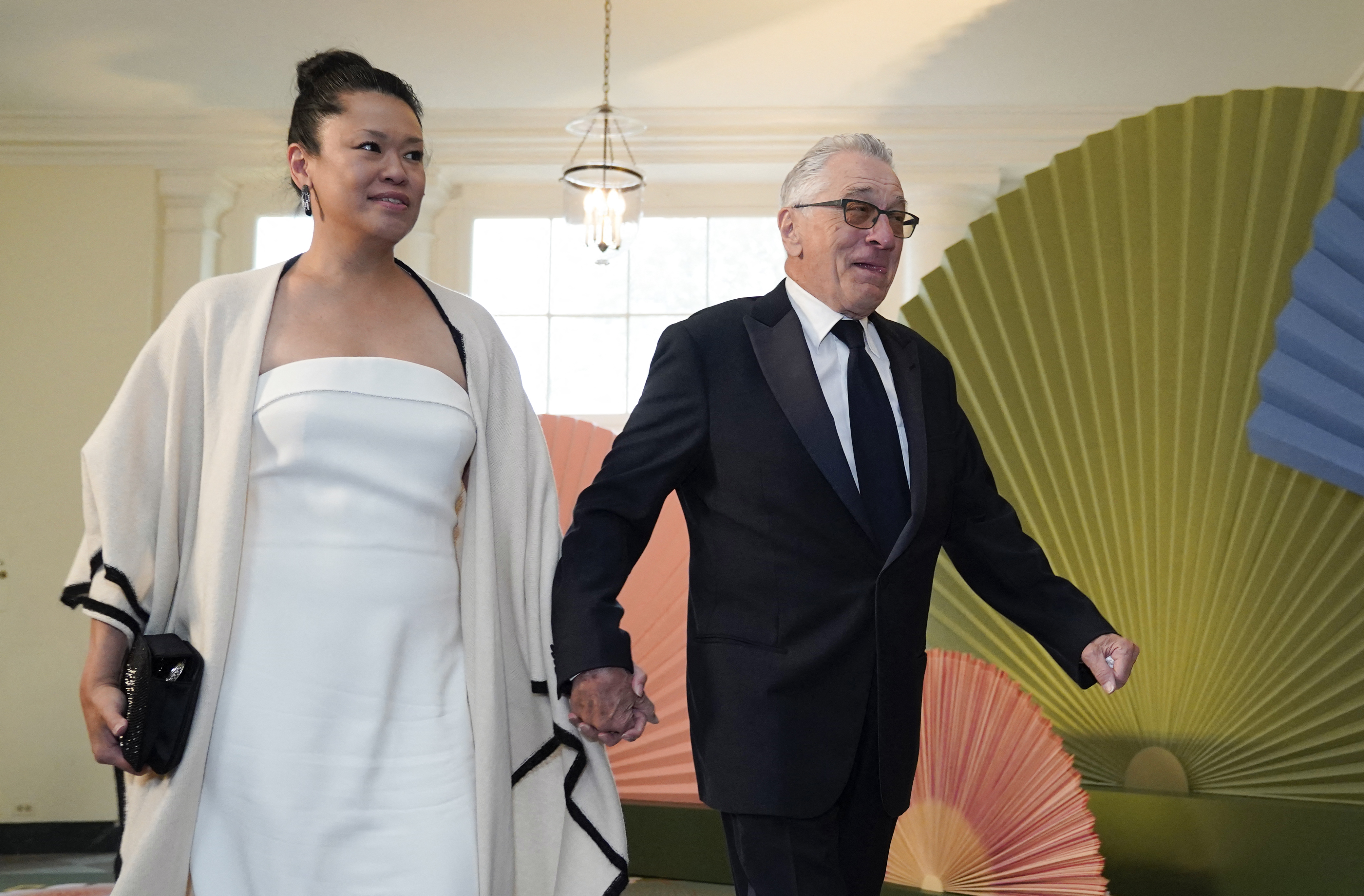 Robert De Niro and Tiffany Chen arrive for a State Dinner in honor of Japanese Prime Minister Fumio Kishida, on April 10, 2024, at the White House in Washington, DC. | Source: Getty Images