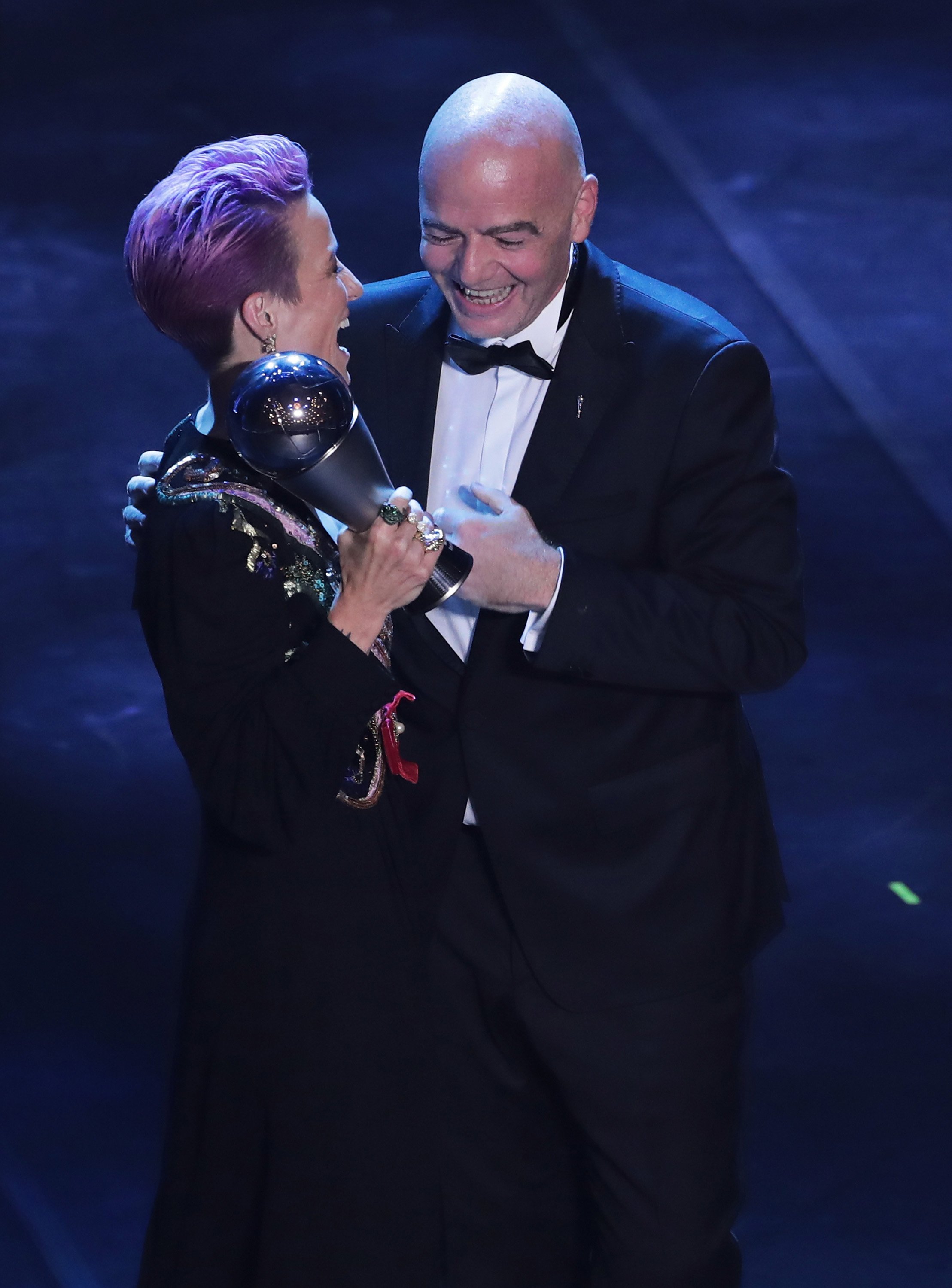  Megan Rapinoe receives The Best FIFA Women's Player of the Year award by FIFA President Gianni Infantino during The Best FIFA Football Awards 2019 on September 23, 2019, in Milan, Italy. | Source: Getty Images.
