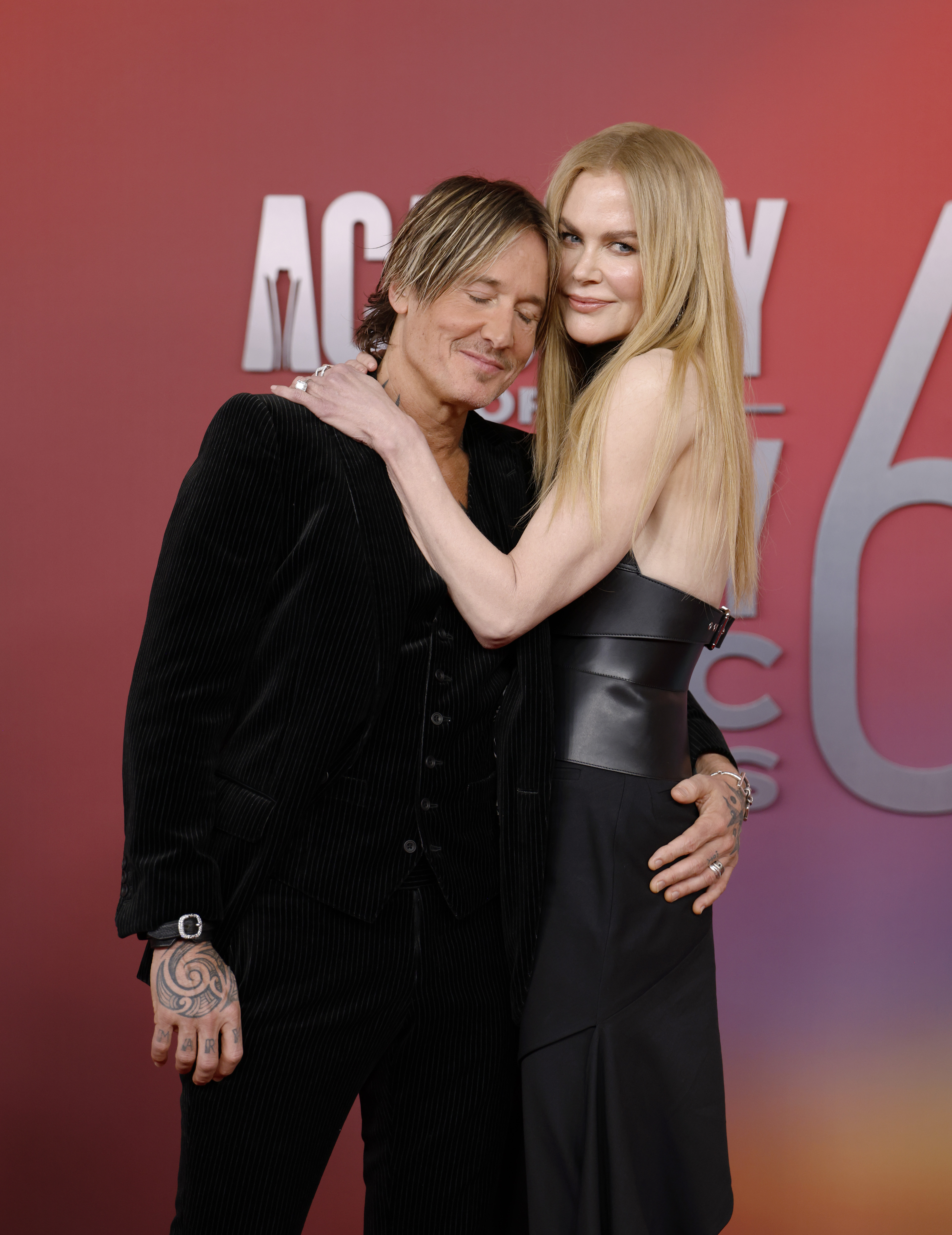 With his eyes closed and her gaze steady, Keith Urban rests in Nicole Kidman's embrace, capturing a serene yet intimate moment in the middle of the media frenzy.