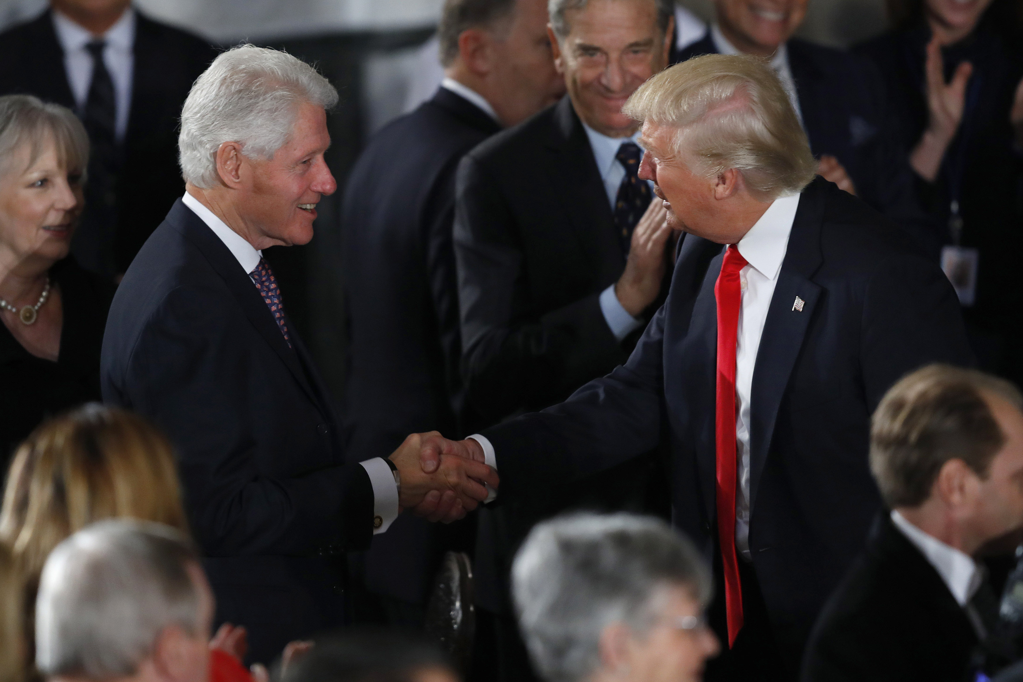Donald Trump greets former President Bill Clinton at the Inaugural Luncheon in the US Capitol on January 20, 2017, in Washington, D.C. | Source: Getty Images