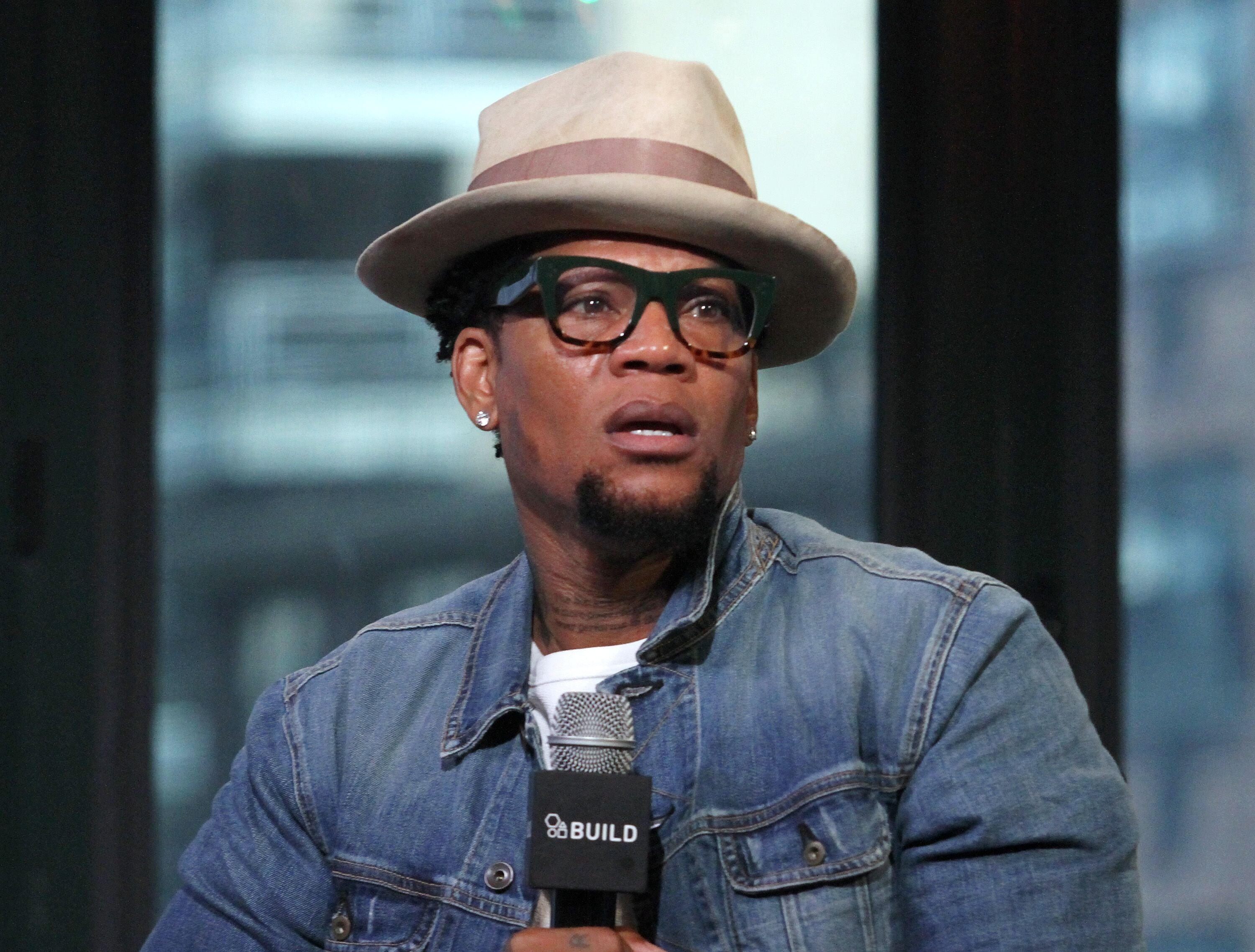 D.L. Hughley promotes "Black Man: White House: An Oral History of the Obama Years" in 2016 | Source: Getty Images