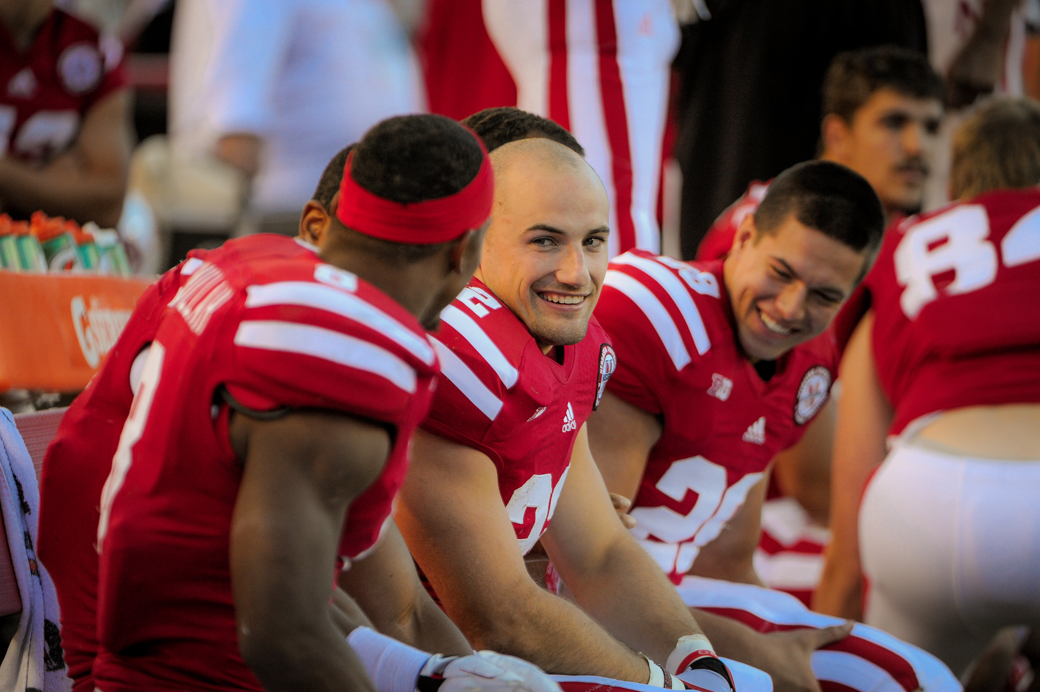 Rex Burkhead sits with his Nebraska Cornhuskers teammates at Memorial Stadium in Lincoln, Nebraska, on September 22, 2012 | Source: Getty Images