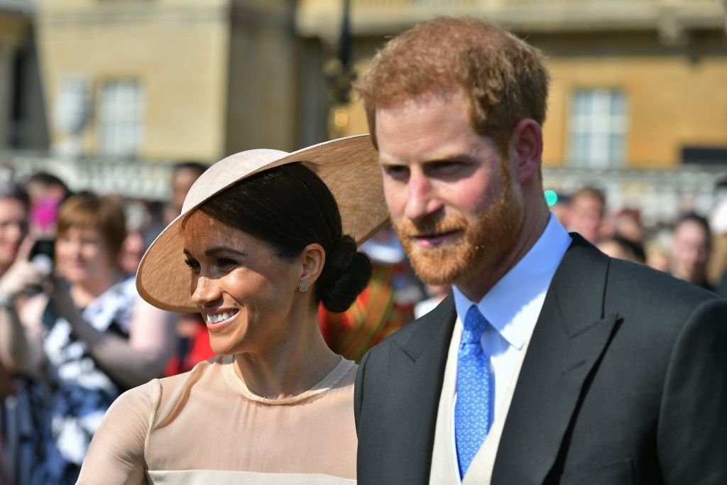Prince Harry, Duke of Sussex, and Meghan, Duchess of Sussex, attend the Prince of Wales' 70th birthday patronage celebration held at Buckingham Palace on May 22, 2018. | Photo: Getty Images