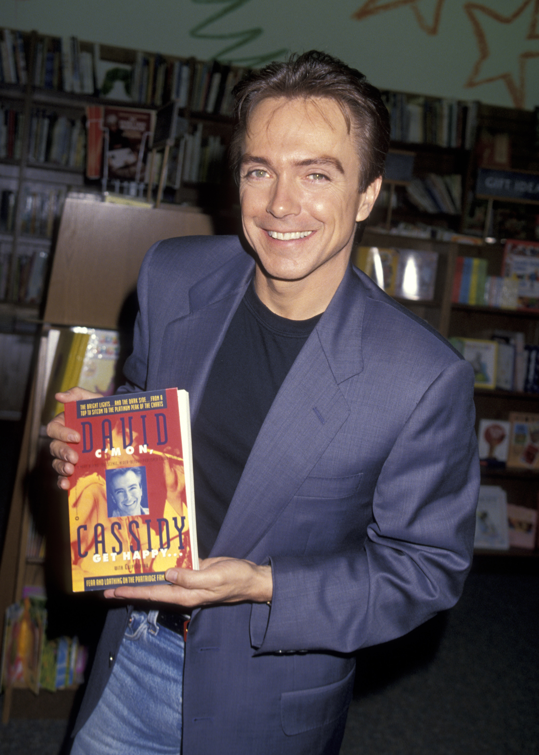 David Cassidy during an in-store appearance to promote his book "C'mon Get Happy" in 1994. | Source: Getty Images