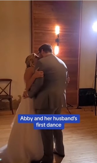Abby Hensel and her husband share a kiss during their first dance as a married couple | Source: Instagram/dailymail