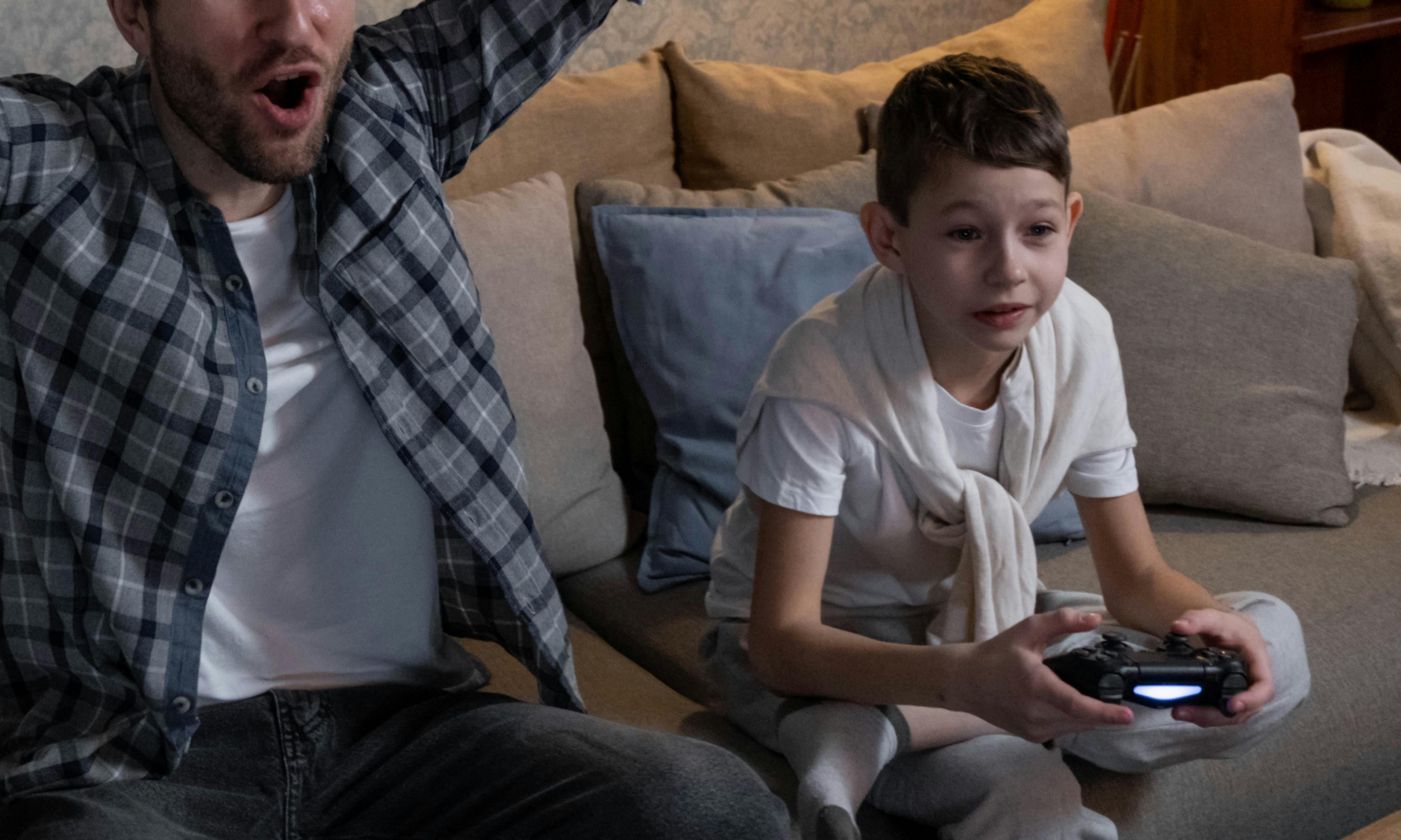 John and Arthur playing video games together | Source: Pexels