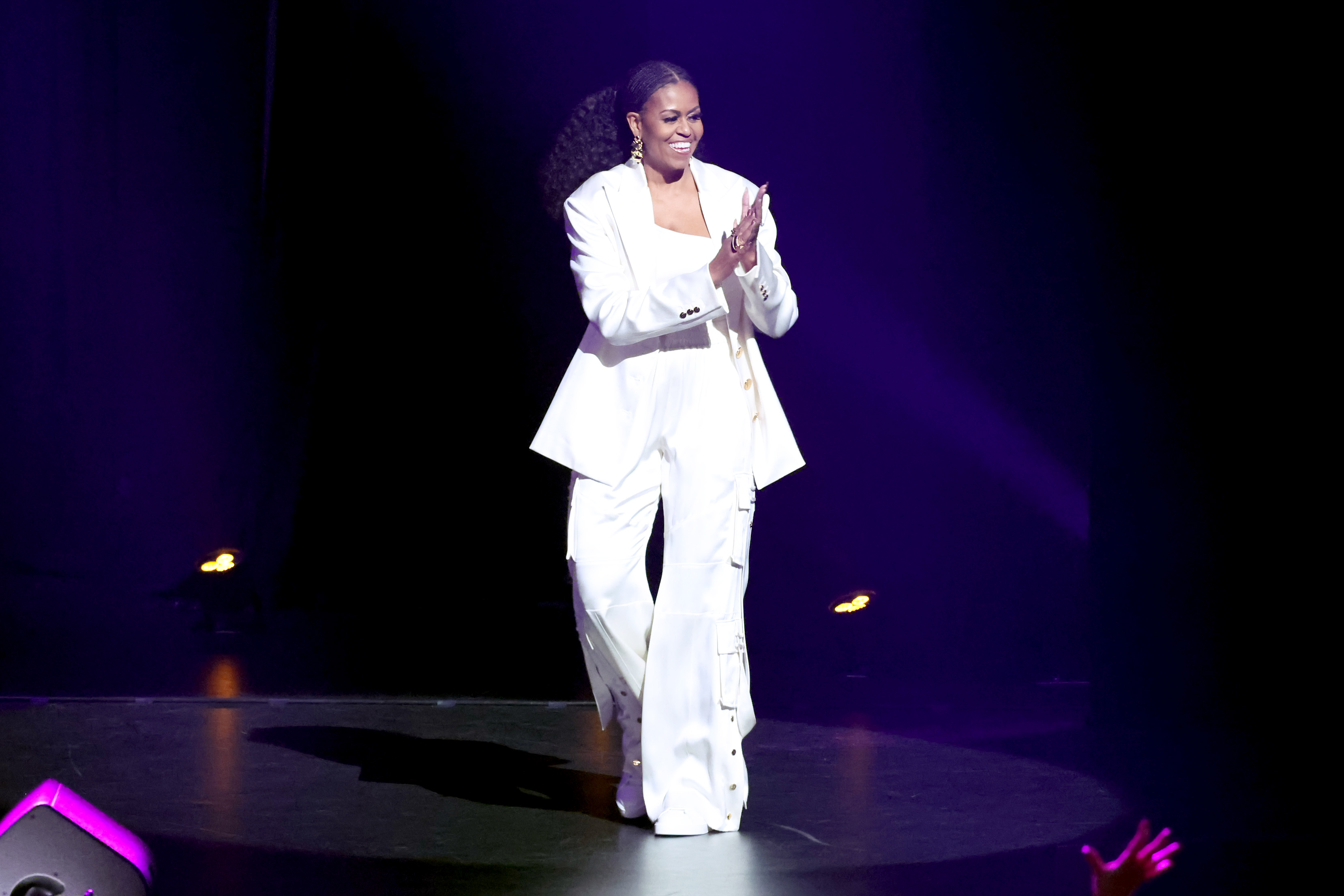 Michelle Obama walks onstage during The Light We Carry: Overcoming in Uncertain Times on December 13, 2022, in Inglewood, California | Source: Getty Image