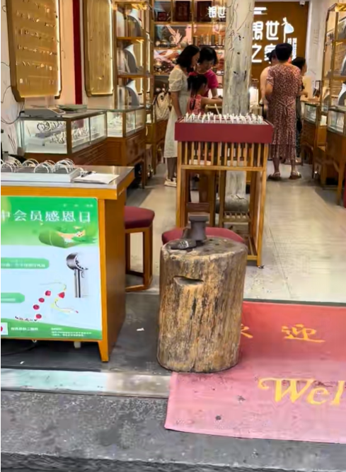 Another part of the video shows the entrance to a storefront, with display cases, customers browsing inside, and a wooden chopping block positioned outside the shop during Amanda "Mandy" Karolkiewicz's trip to China. | Source: TikTok/mandykarolk