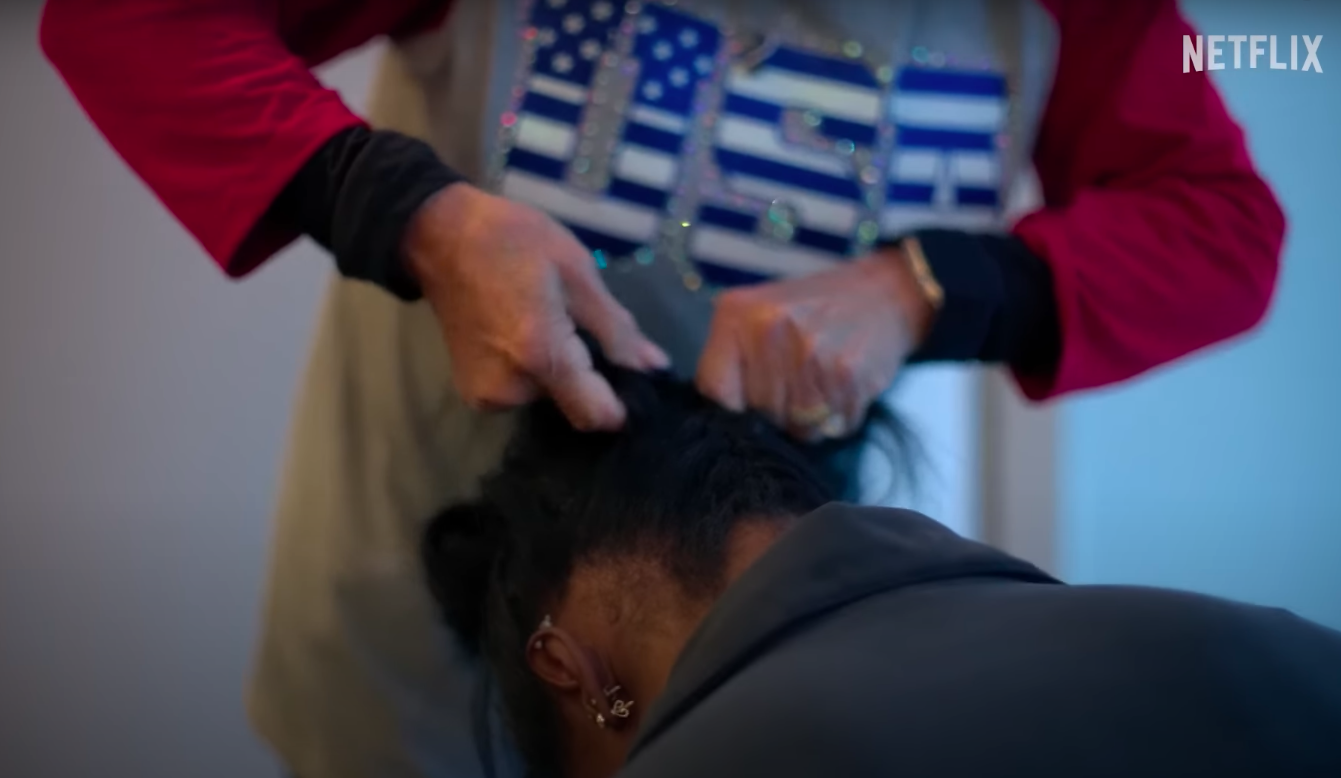 Nellie Biles doing Simone Biles' hair, posted on July 15, 2024 | Source: YouTube/Netflix