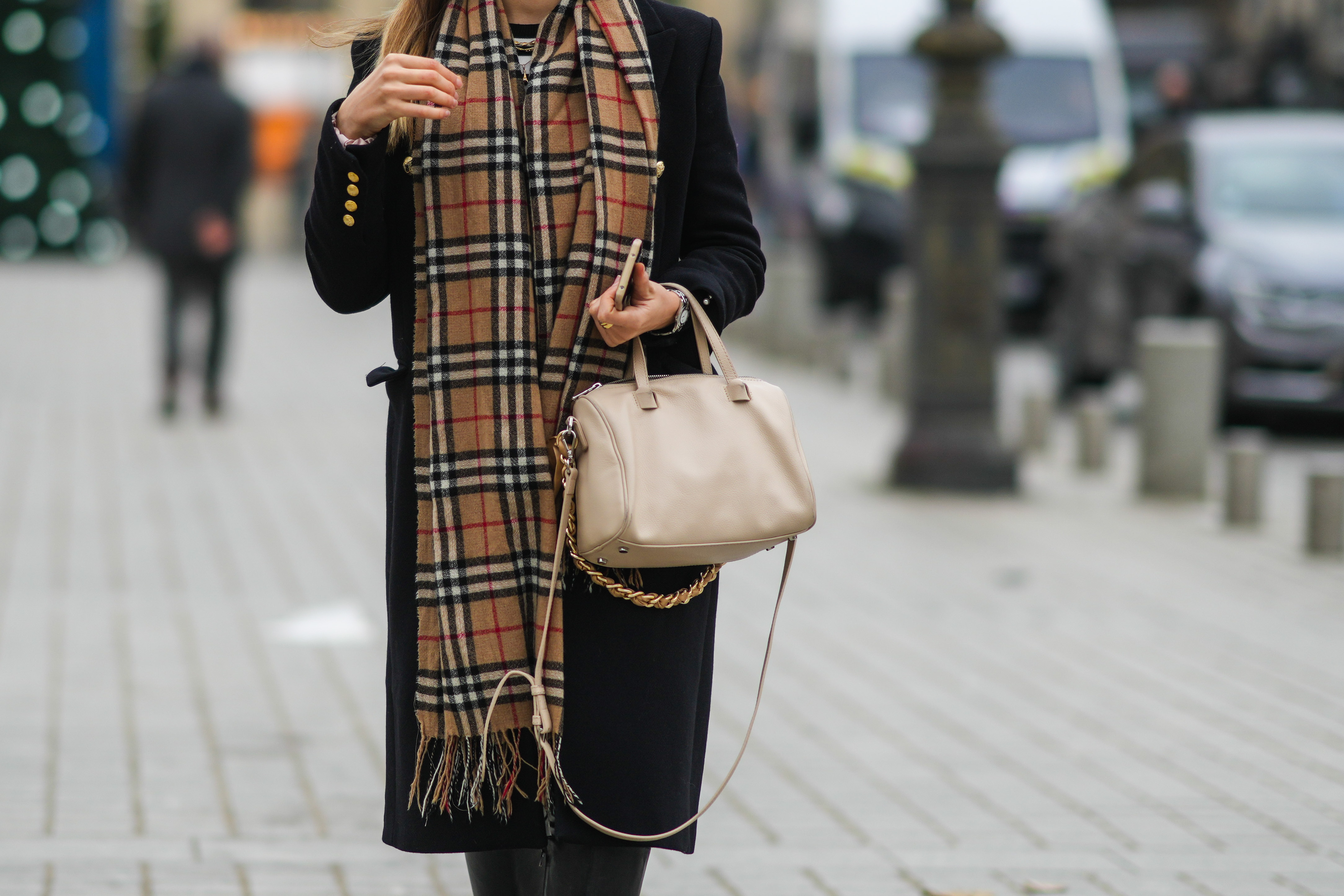 Woman with a plaid scarf | Source: Getty Images