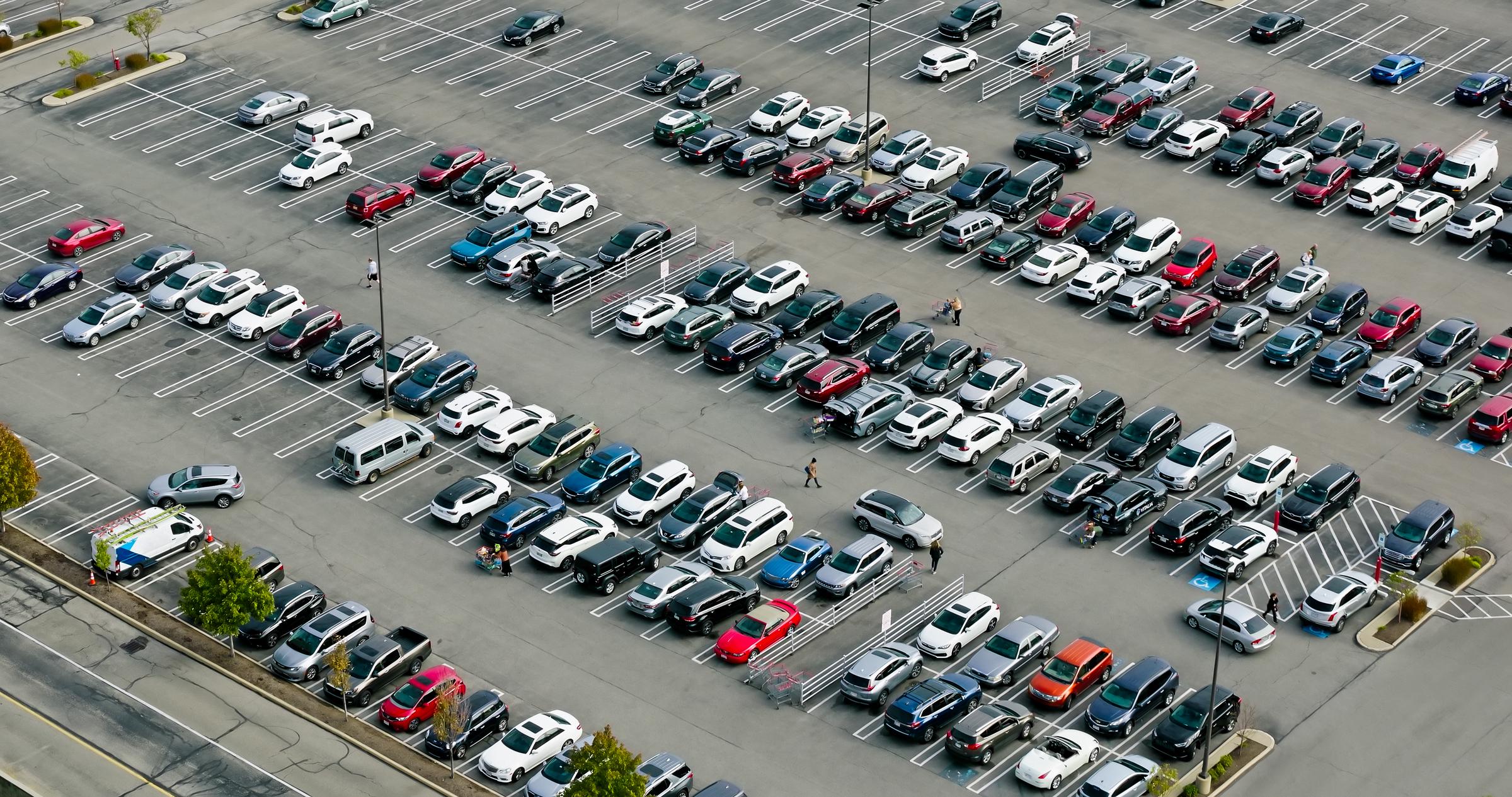 High angle aerial shot of a shopping center's large parking lot. | Source: Getty Images