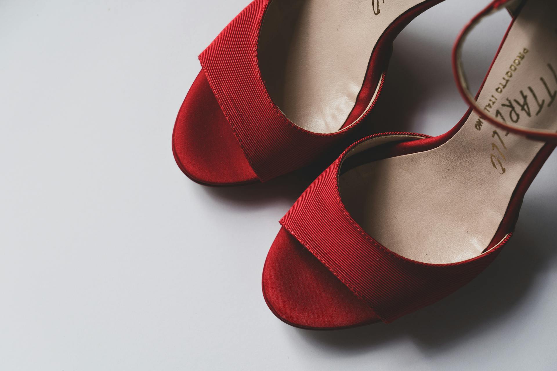 Red shoes on floor | Source: Pexels