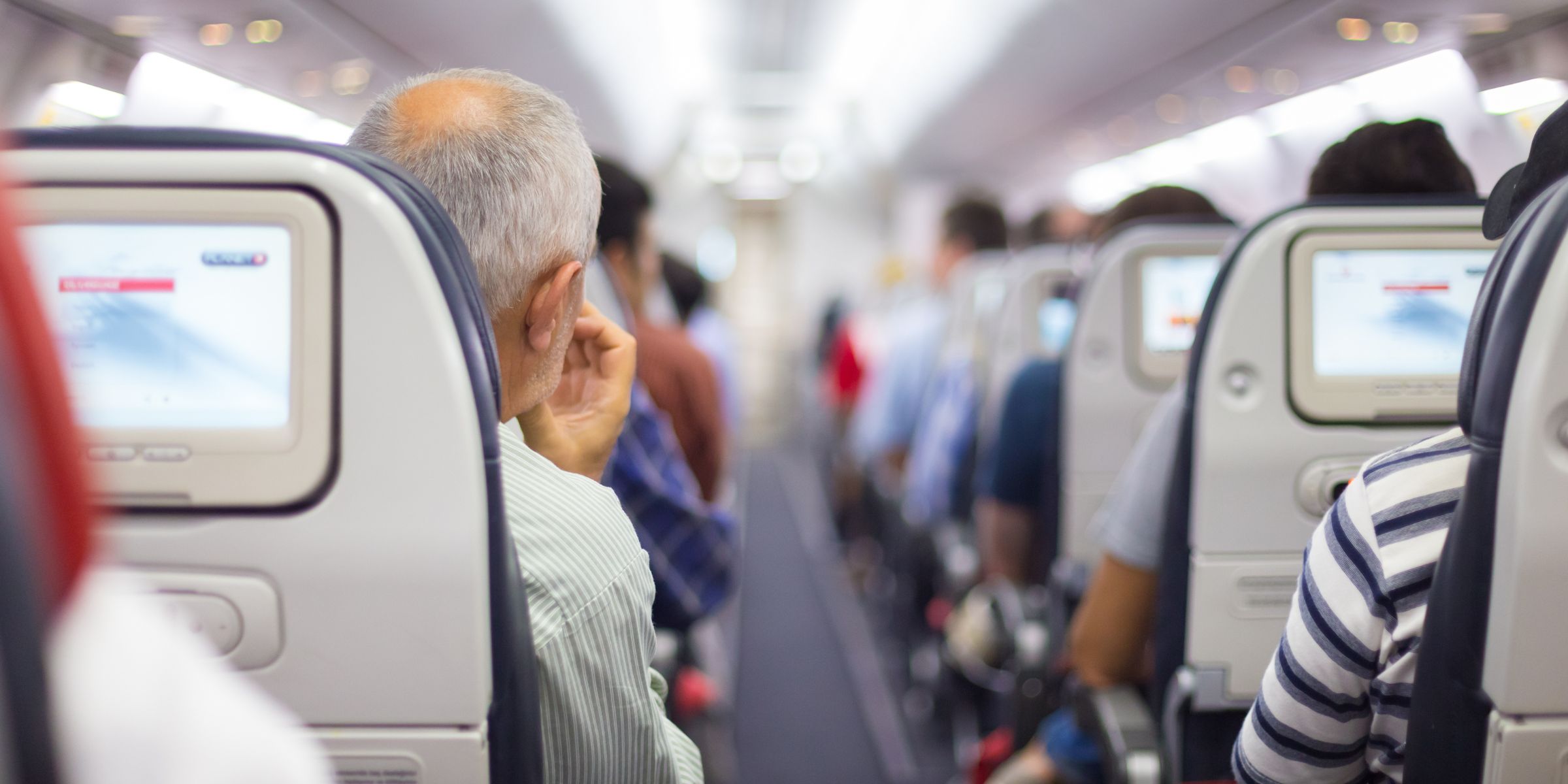 Passengers in an airplane | Source: Shutterstock