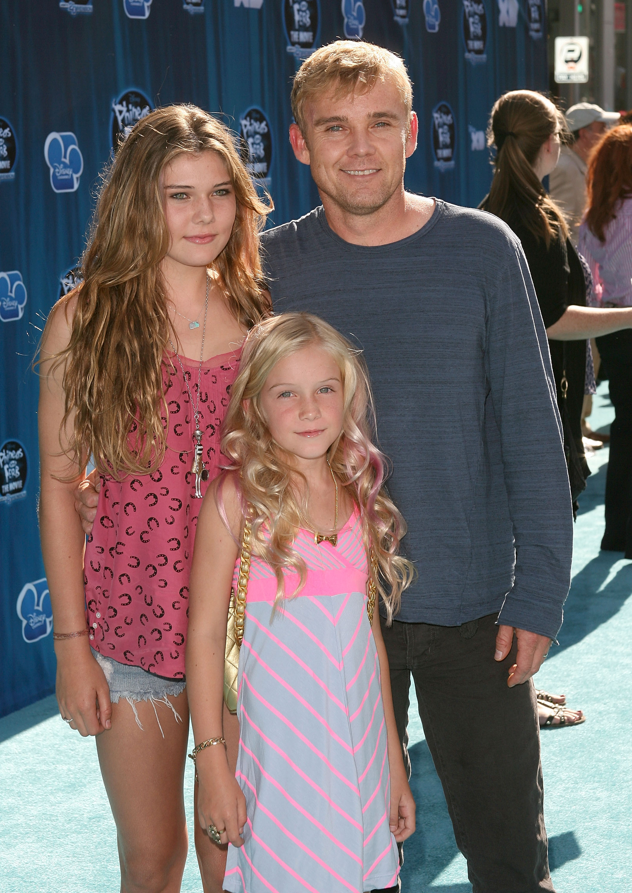 The former child star and his daughters at the premiere of "Phineas and Ferb: Across The 2nd Dimension" on August 3, 2011, in Hollywood, California. | Source: Getty Images