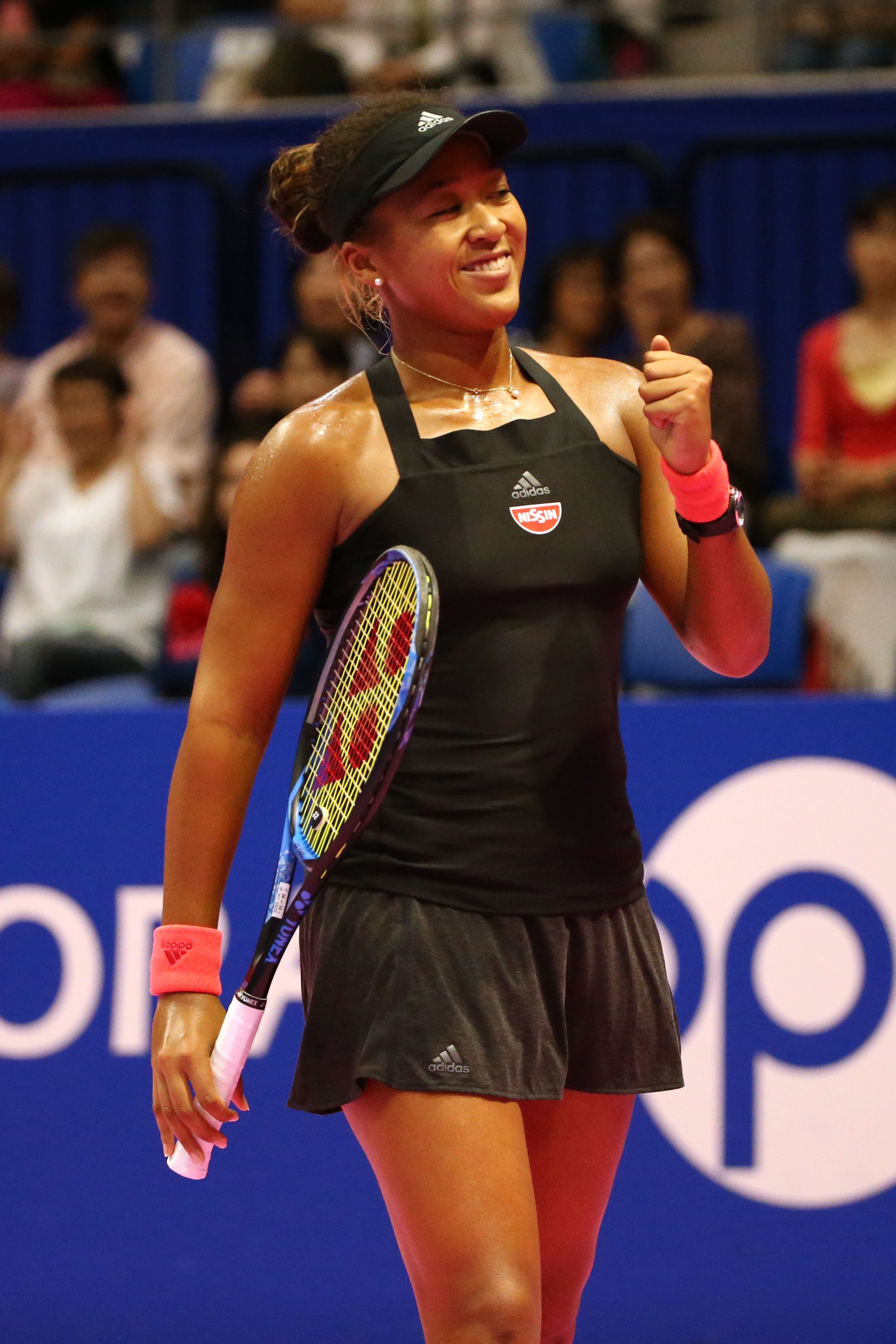 Naomi Osaka celebrating her victory in the singles second round match against Dominika Cibulkova on September 19, 2018 in Tokyo. | Photo: Getty Images