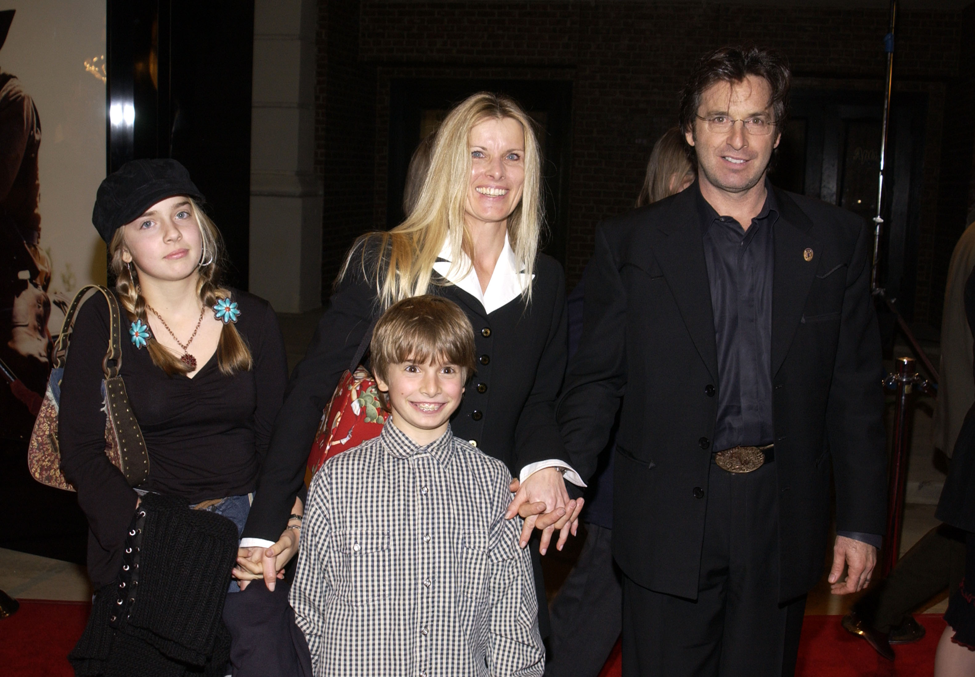 Robert Carradine with Edith Mani and their son, Ian, and daughter, Marica at TNT's "Monte Walsh" premiere on January 8, 2003 | Source: Getty Images