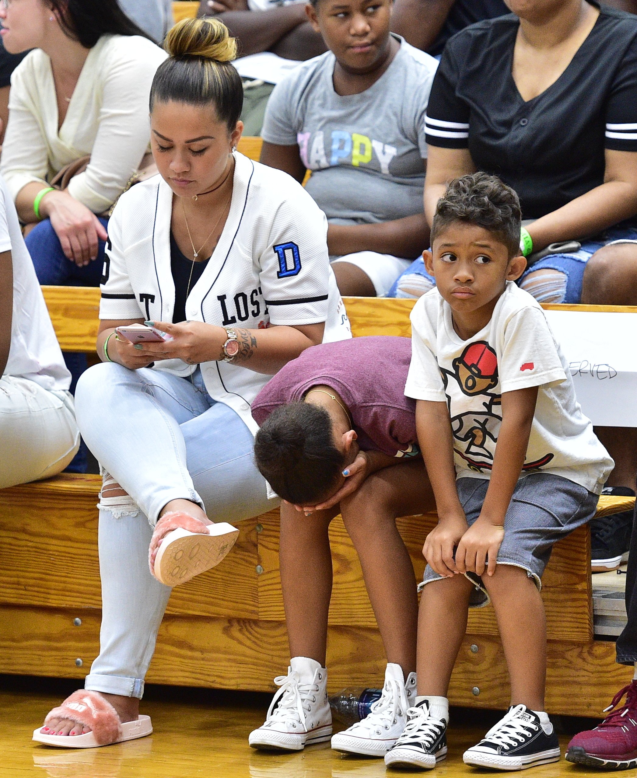 Sarah Vivan, Essence Vivan, and Dwayne Michael Carter III at the LudaDay Weekend Celebrity Basketball Game on September 4, 2016, in Atlanta | Source: Getty Images