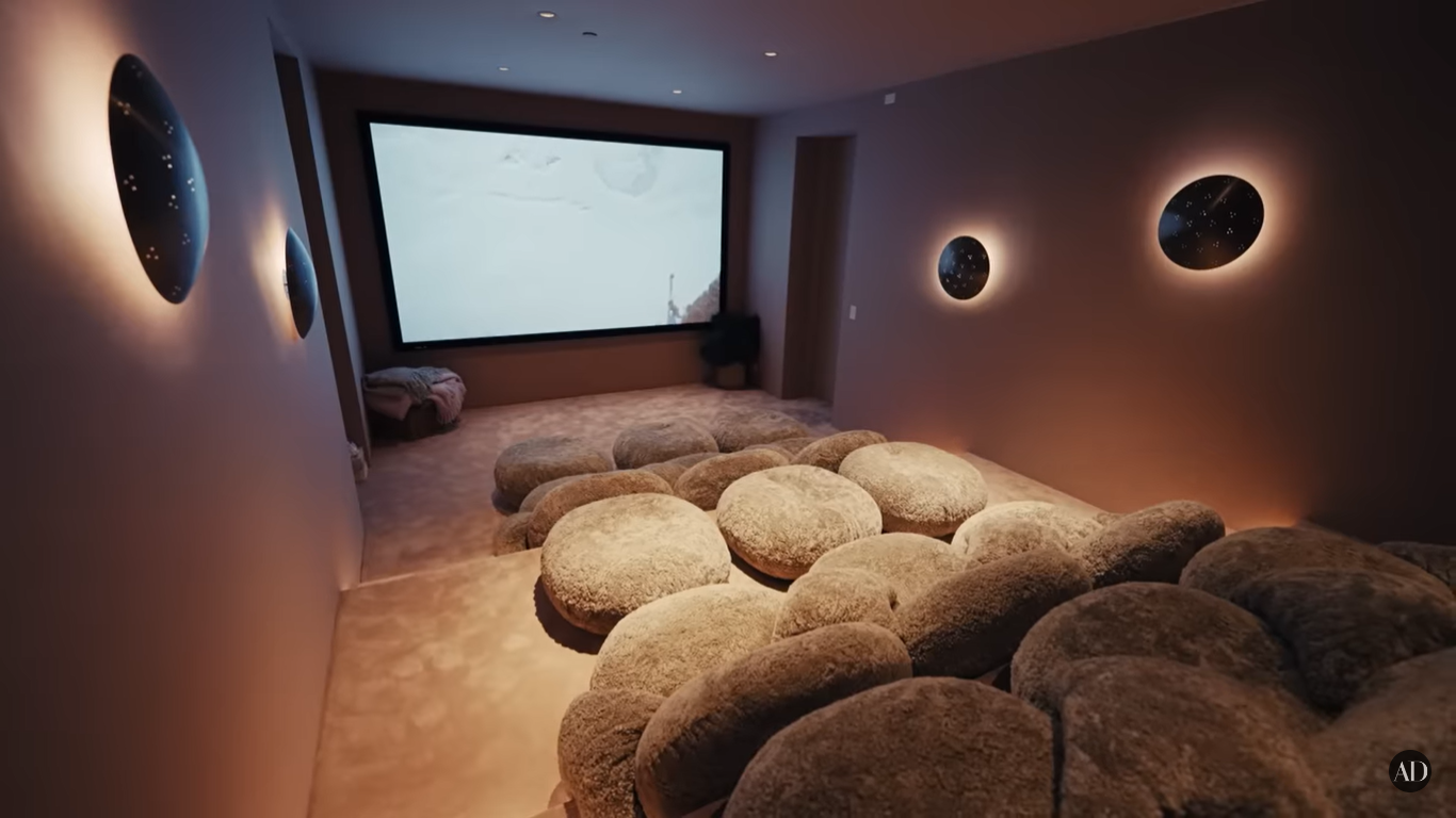 Chrissy Teigen and John Legend's cinema at their Beverly Hills home | Source: YouTube/ArchitecturalDigest