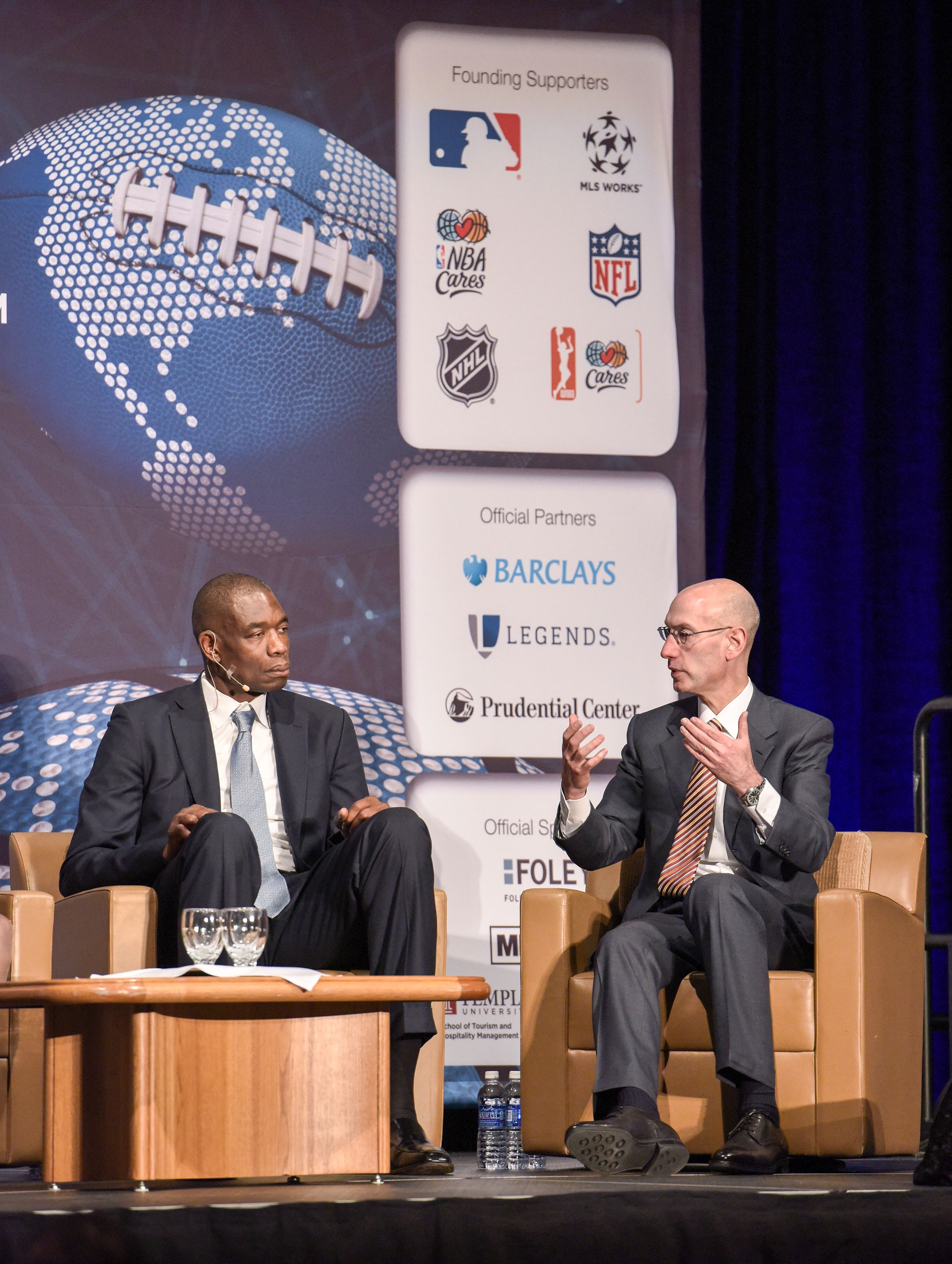 Dikembe Mutombo and NBA Commissioner Adam Silver at the Beyond Sport United 2015 in Newark City on July 22, 2015 | Source: Getty Images