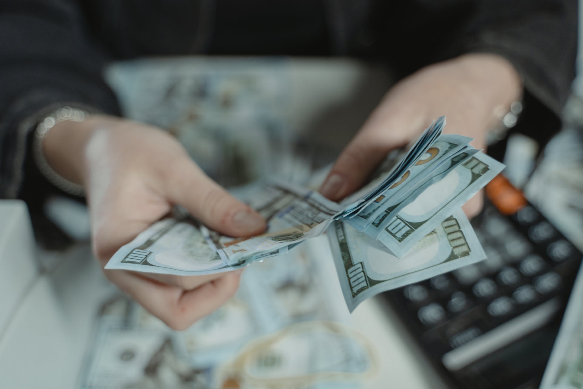 A person counting money | Source: Pexels