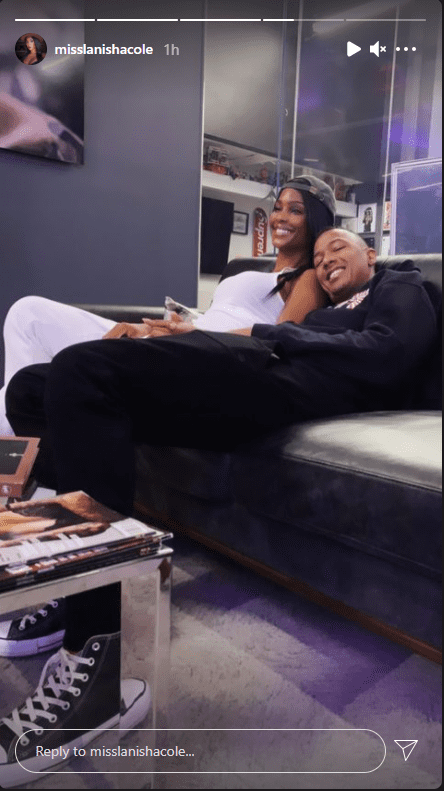 Nick Cannon and LaNisha Cole cuddle up in a sofa. | Source: Instagram/misslanishacole