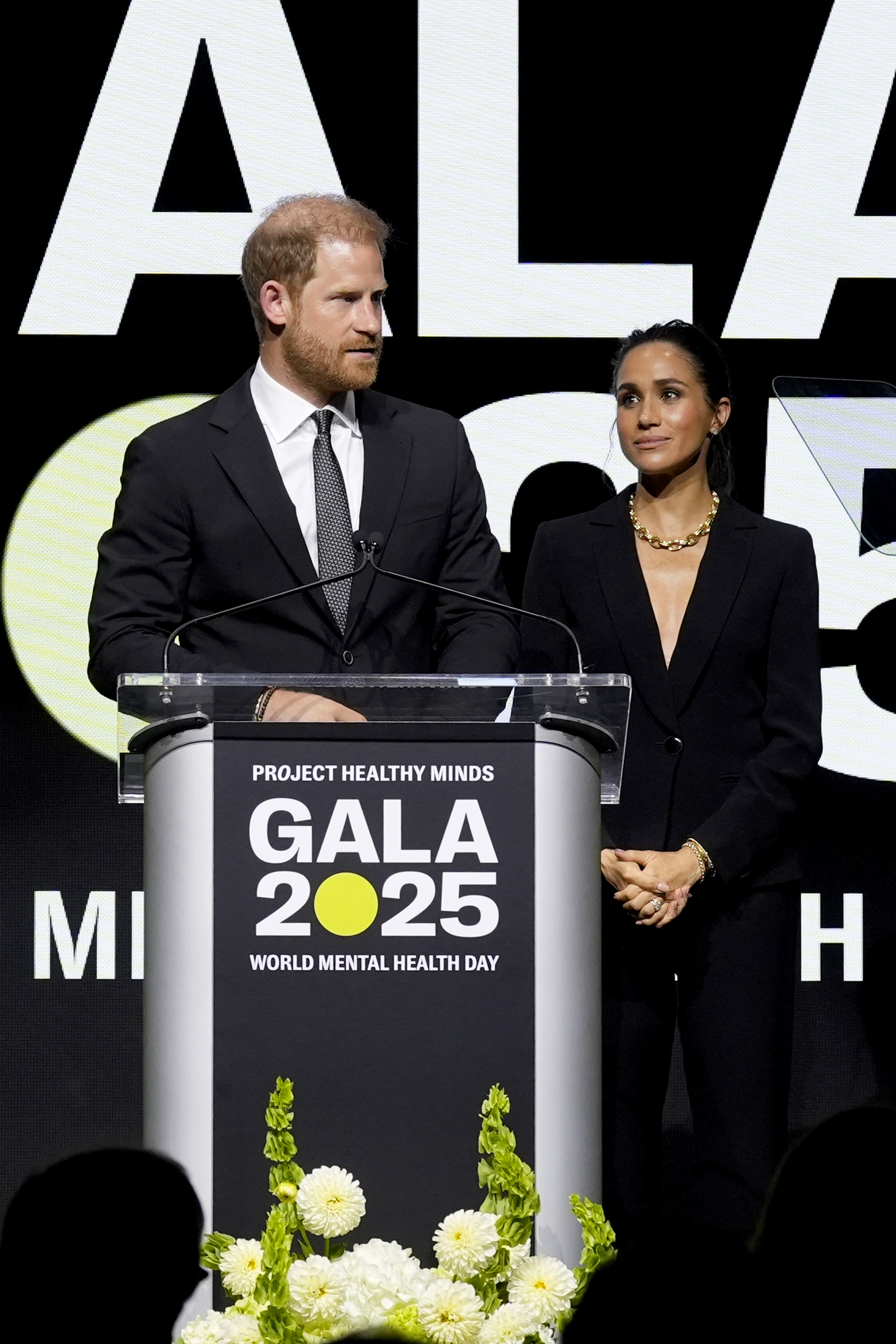 Prince Harry and Meghan Markle speak onstage the Project Healthy Minds World Mental Health Day Gala in New York City  on October 9, 2025 | Source: Getty Images