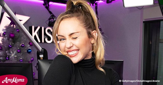Miley Cyrus shares throwback photo wearing a sheer racy yellow dress with no bra underneath