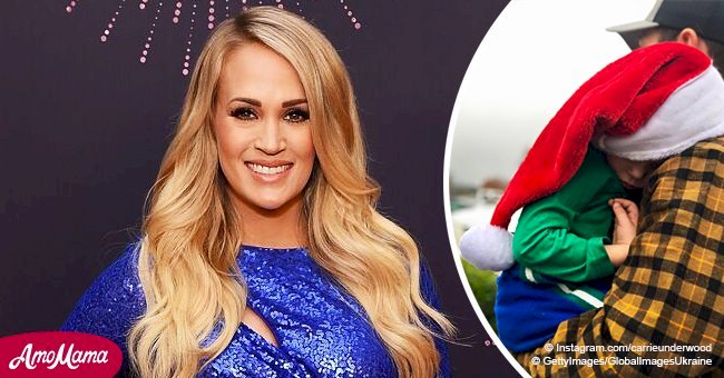 Carrie Underwood’s son falls asleep in dad’s arms, because even Santa’s helpers get tired
