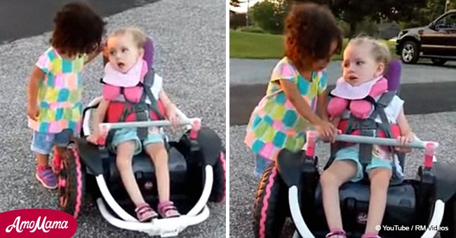 Little girl approaches child in motorized wheelchair and encourages her to drive (video)