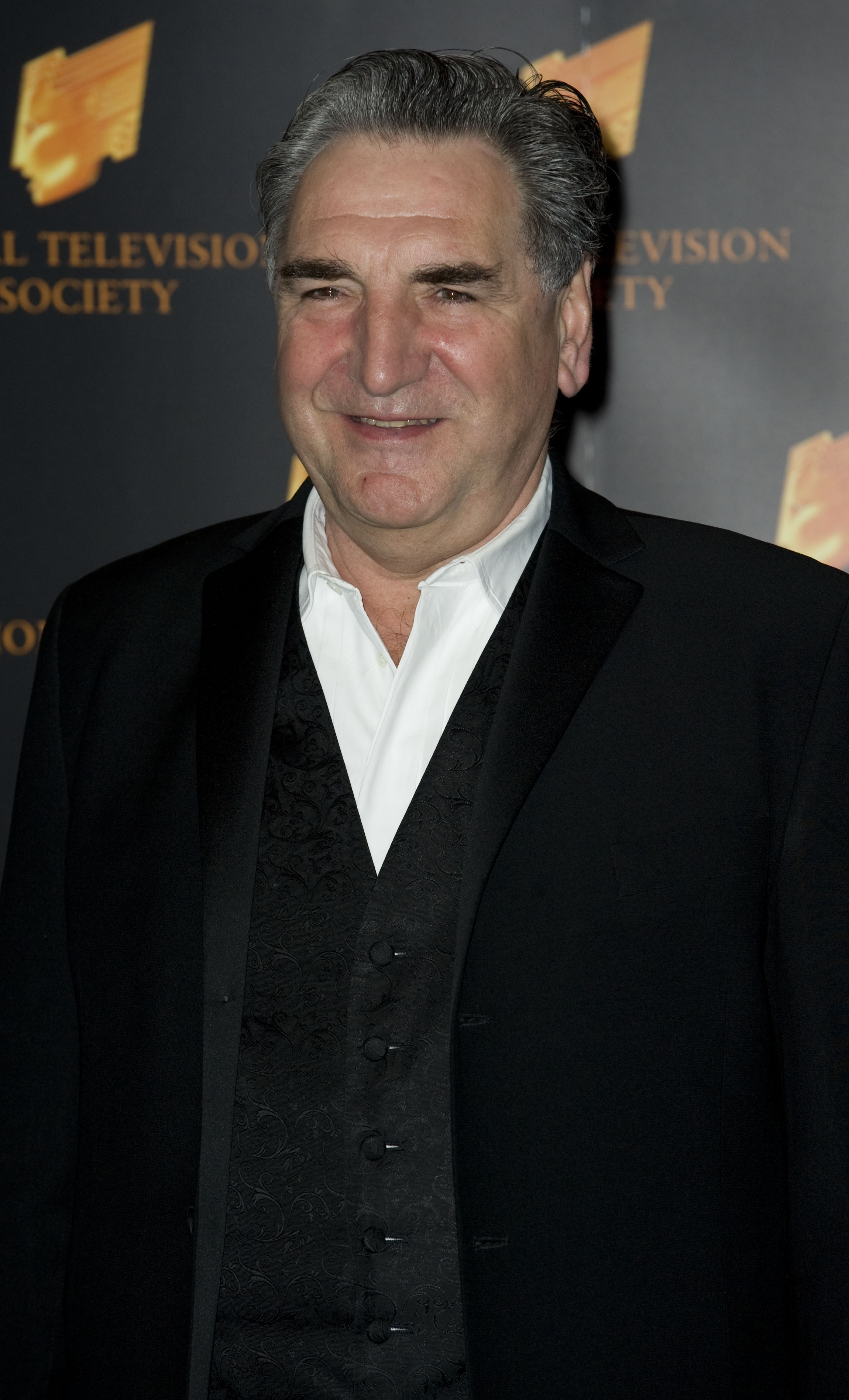 Jim Carter attended the RTS Programme Awards in 2010 with a dark suit, patterned vest, and signature slicked-back hair. His classic and reserved style mirrored the quiet strength and authority of his character, Mr. Carson, the dignified butler of "Downton Abbey."