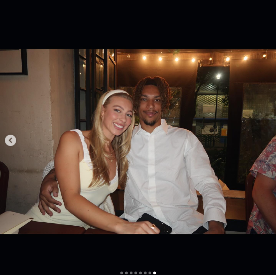 Brandon Clarke smiles beside his sister during a dinner celebration as the siblings pose together at a warmly lit venue. | Source: Instagram/brandon_clarke23