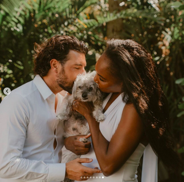Andrea Preti and Venus Williams cuddling with their dog, posted on April 4, 2026. | Source: Instagram/venuswilliams and andreapreti88