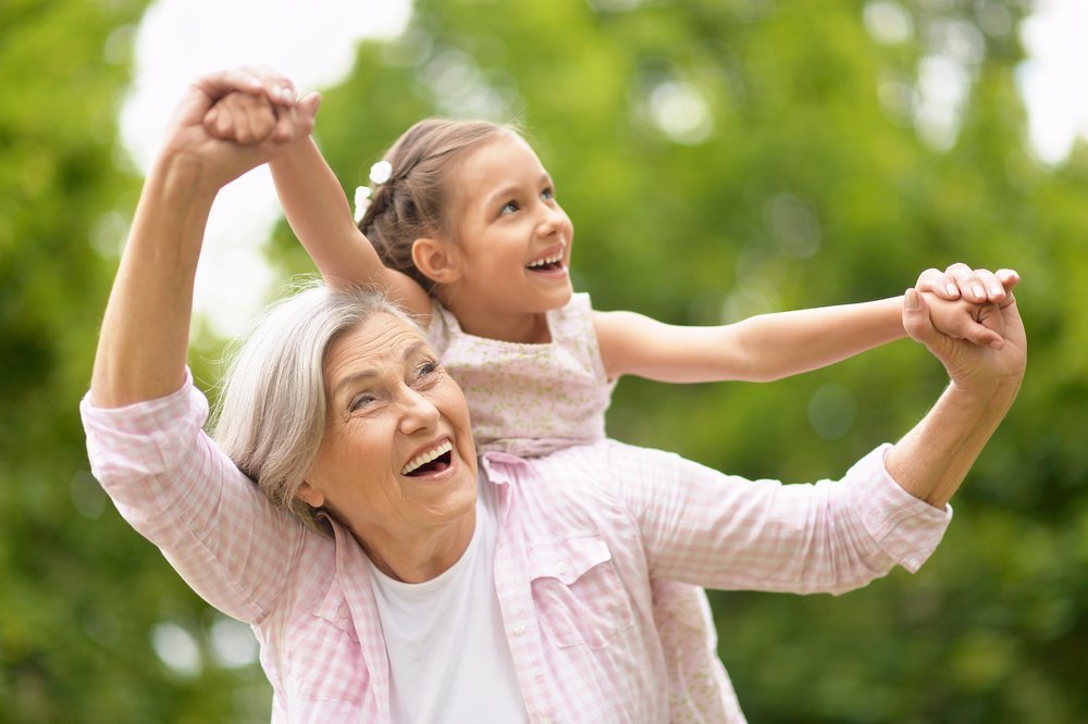 A grandmother with her granddaughter in the park. | Photo: Shutterstock