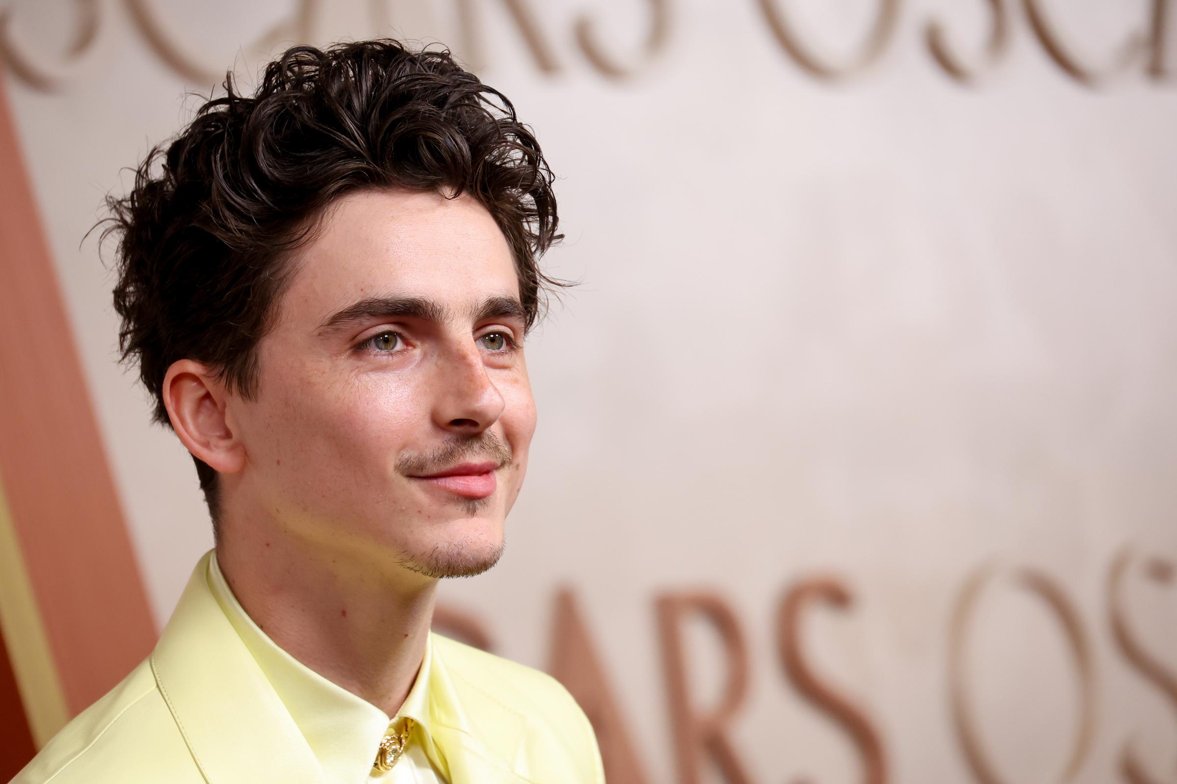 Timothée Chalamet looked dashing in yellow with his curly hair styled upward at the 97th Oscars, held at the Dolby Theatre on March 2, 2025, in Hollywood, California.