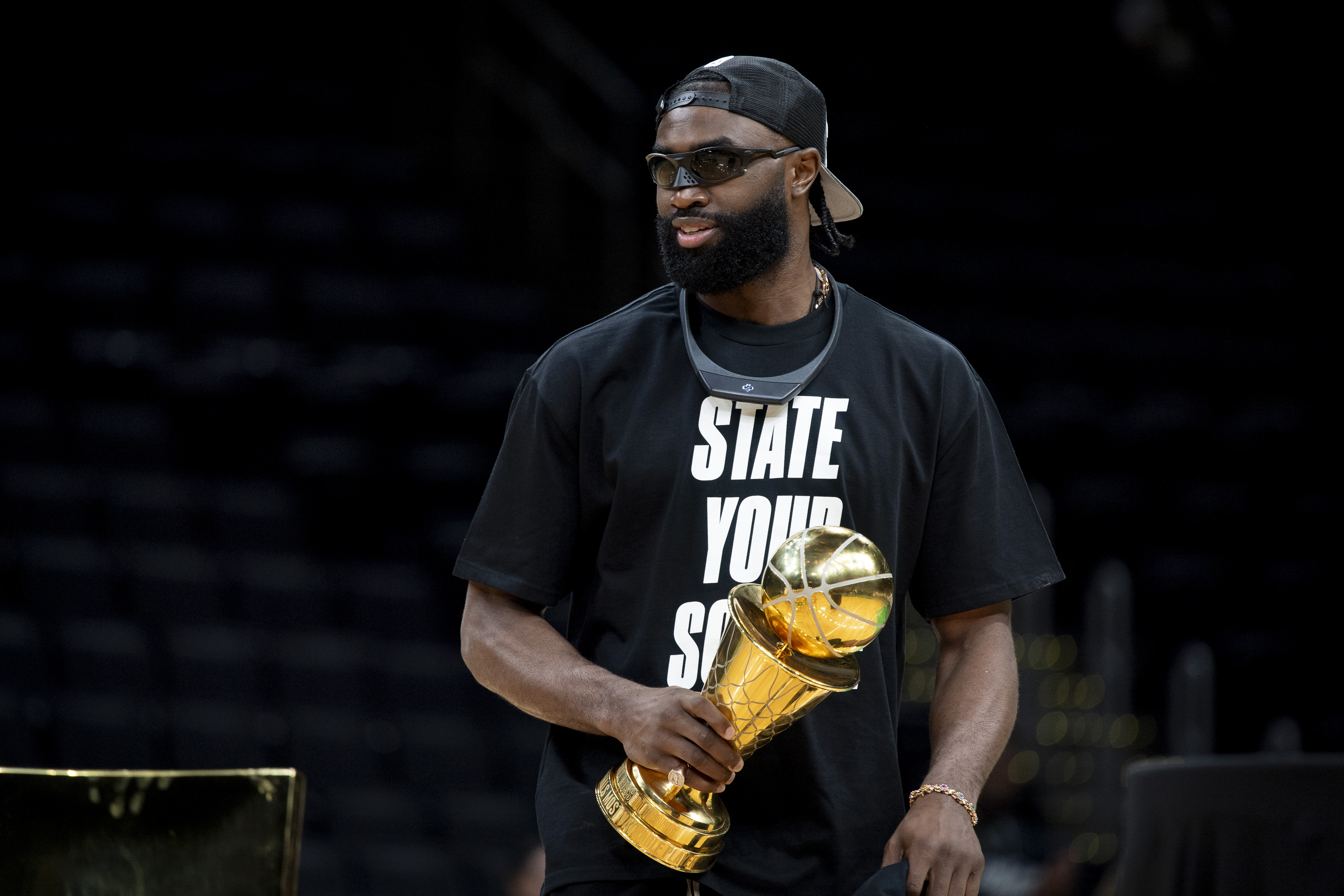 Jaylen Brown holds the MVP trophy during the Boston Celtics’ championship celebration following the 2024 NBA Finals win at TD Garden in Boston on June 21, 2024. | Source: Getty Images
