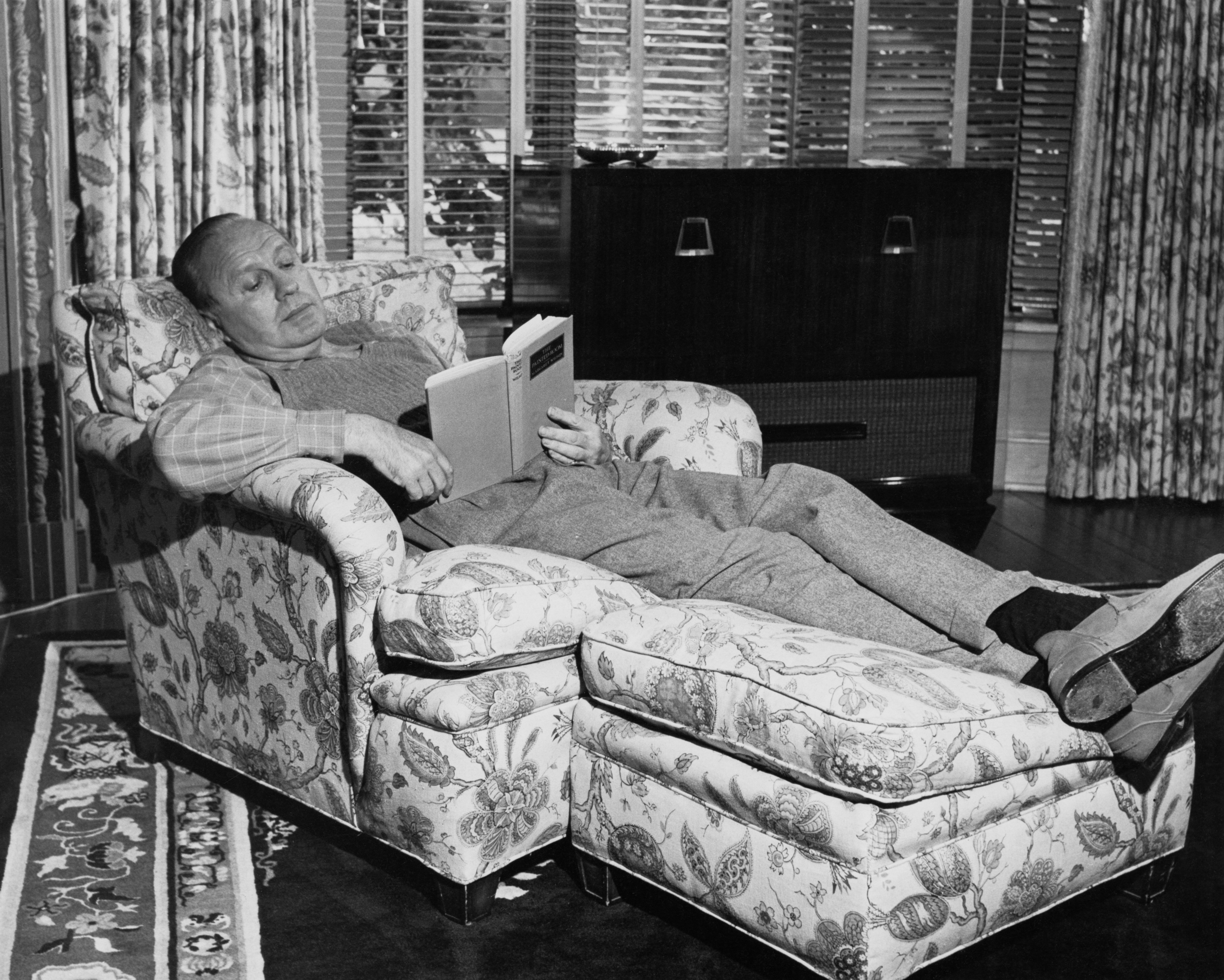 American comedian and actor Jack Benny (1894 - 1974) reading 'The Painted Room' by Margaret Wilson, circa 1955. | Source: Getty Images