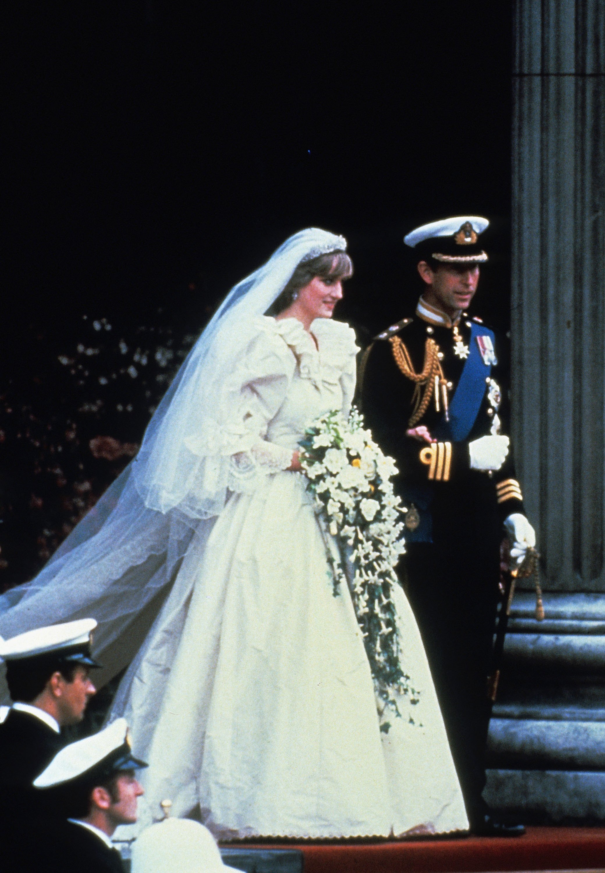 Prince Charles, Prince of Wales and Diana, Princess of Wales, wearing a wedding dress designed by David and Elizabeth Emanuel and the Spencer family Tiara, leave St. Paul's Cathedral following their wedding on July 29, 1981 in London, England. | Source: Getty Images