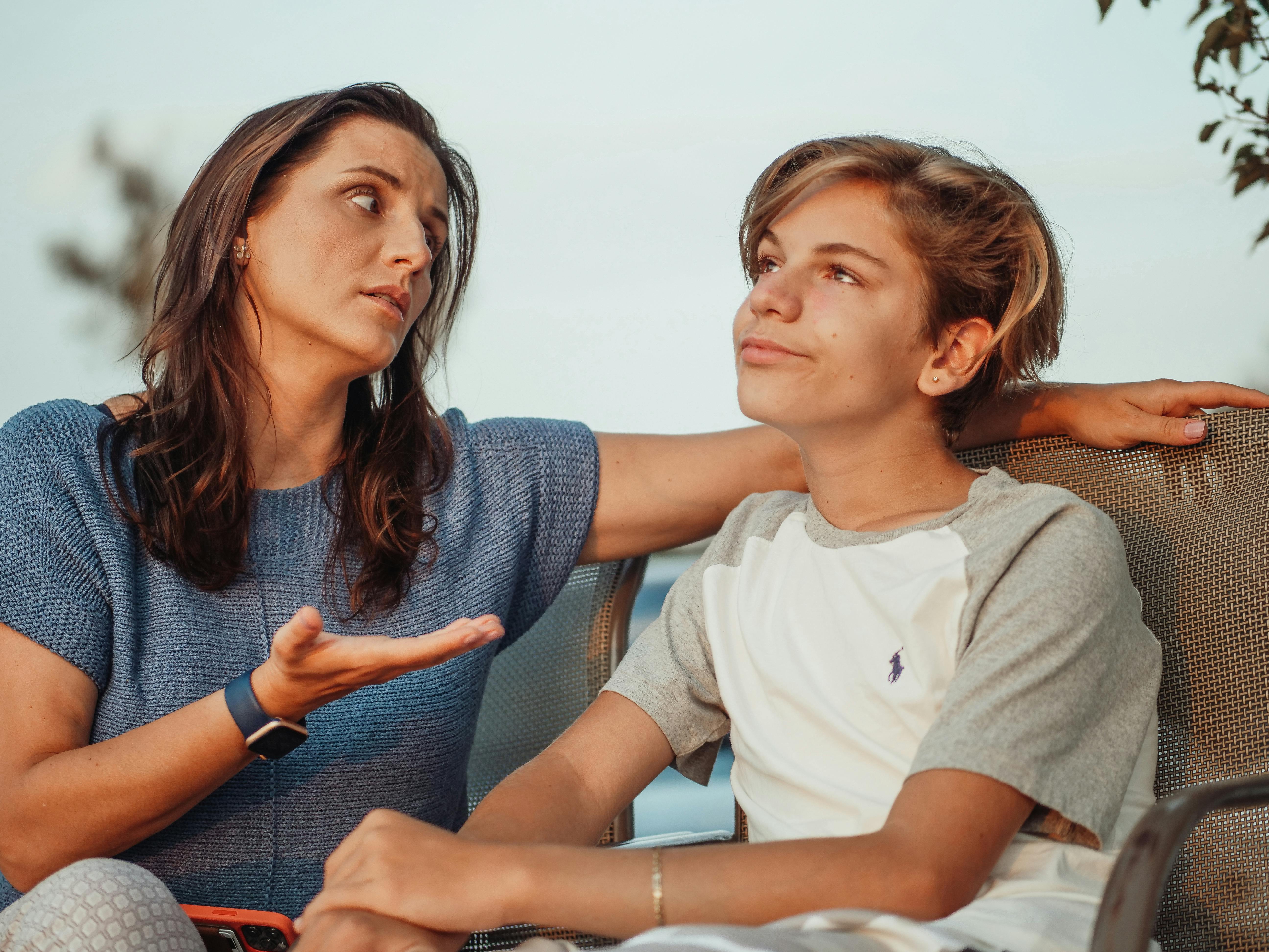 A mother having a conversation with her son | Source: Pexels