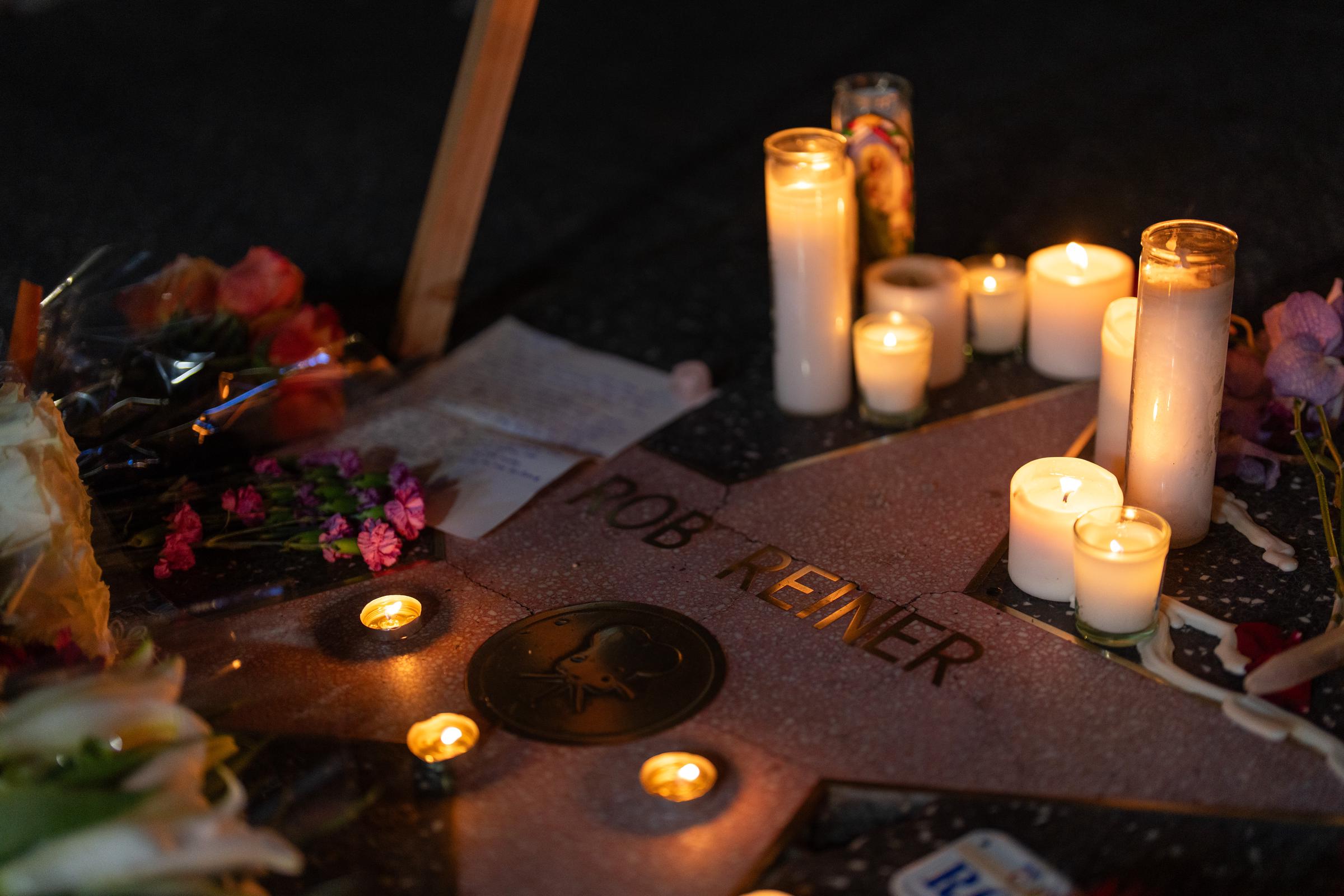 Flowers and candles are placed on director/actor Rob Reiner's Star on the Hollywood Walk of Fame on 15 December 2025 in Los Angeles, California. | Source: Getty Images