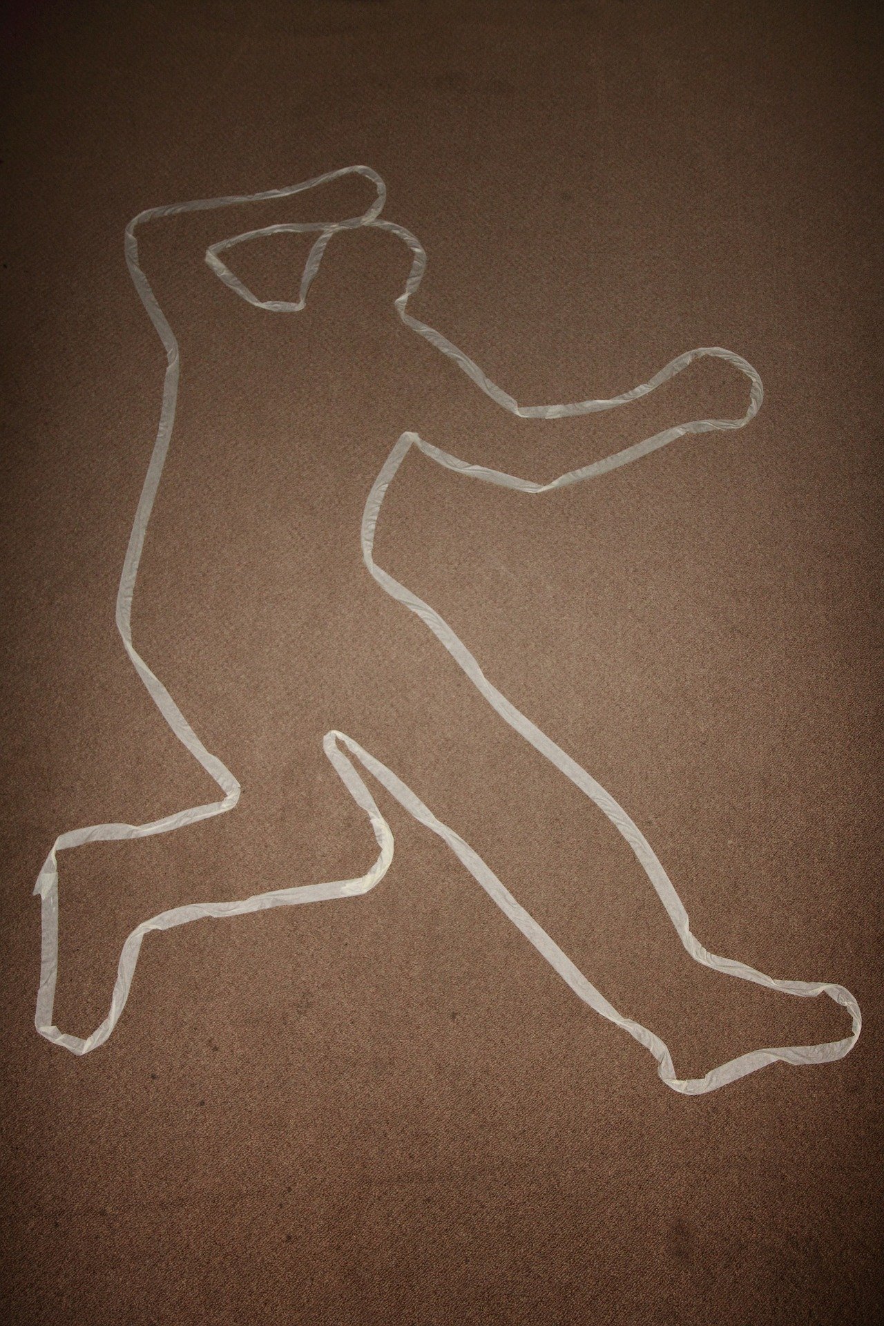 A photo depicting a body at a crime scene | Source: Pixabay