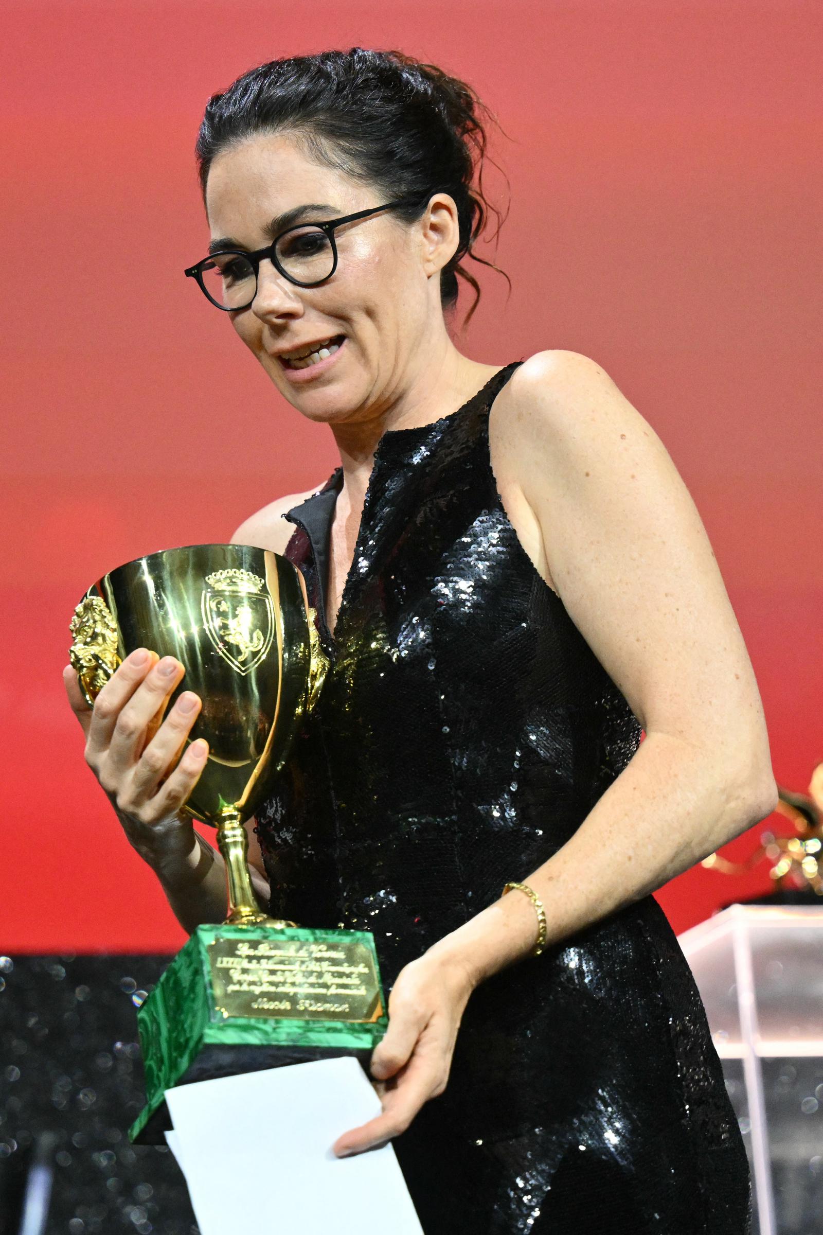 Halina Reijn accepts the Coppa Volpi for Best Actress on behalf of Nicole Kidman at the 81st Venice Film Festival award ceremony on September 7, 2024 | Source: Getty Images