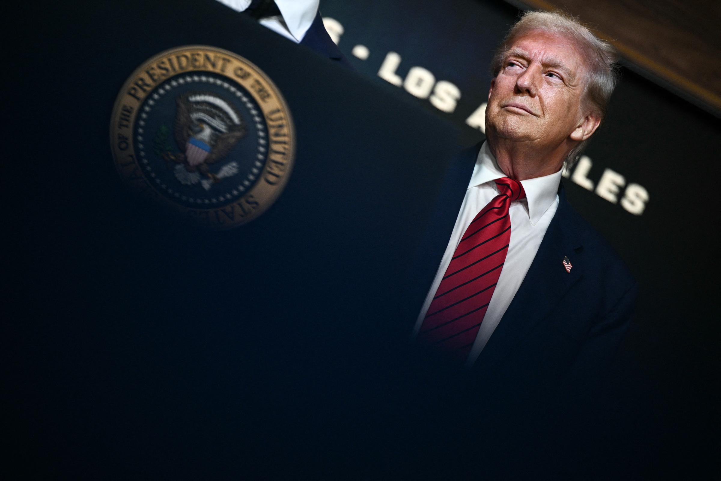 President Donald Trump looks on thoughtfully before signing an executive order in the South Court Auditorium at the White House, where he established a task force to support the 2028 Olympics in Los Angeles.