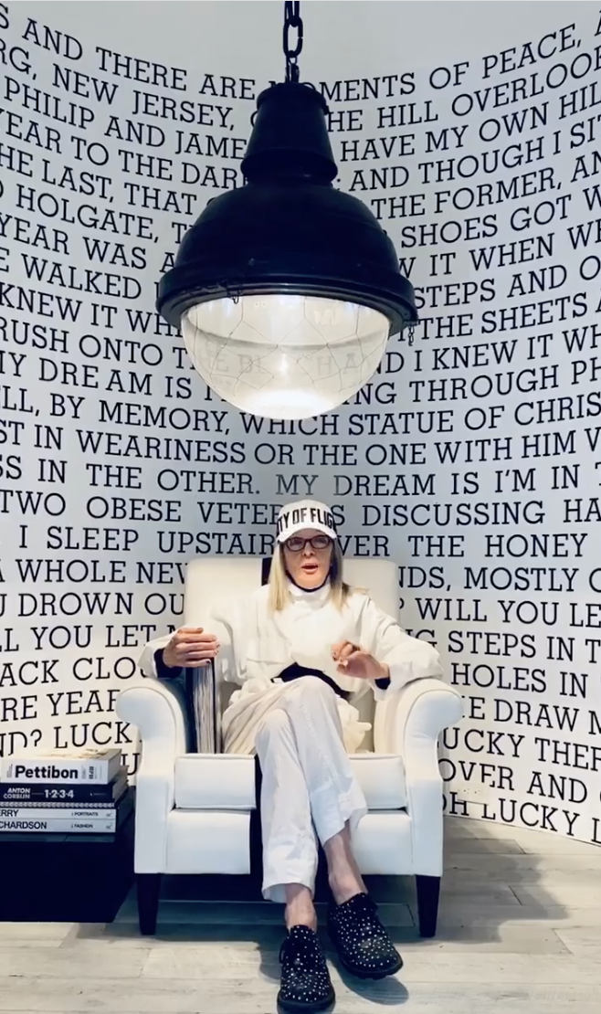 Diane Keaton pictured seated in front of a floor-to-ceiling text mural inside her Sullivan Canyon home, dated July 23, 2020 | Source: Instagram/diane_keaton