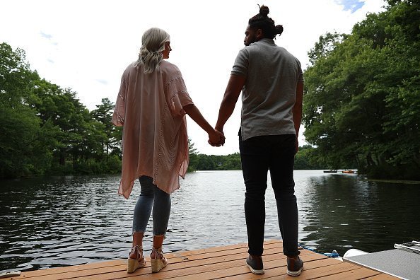 Photo of a man and woman holding hands | Photo: Getty Images