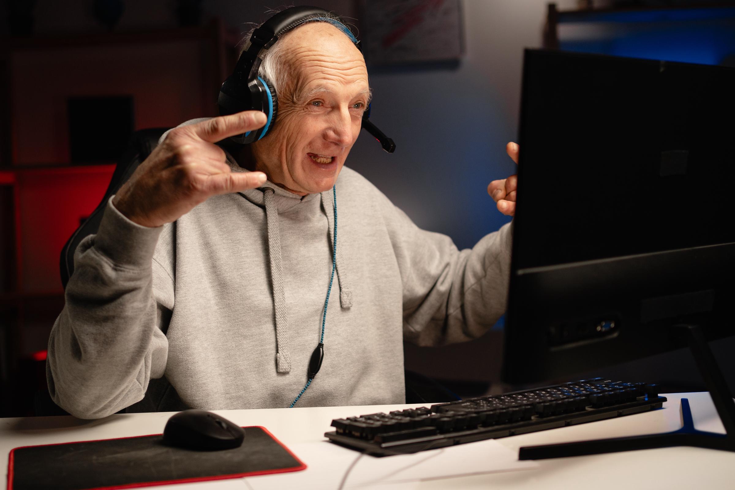 Senior man playing a video game online | Source: Shutterstock