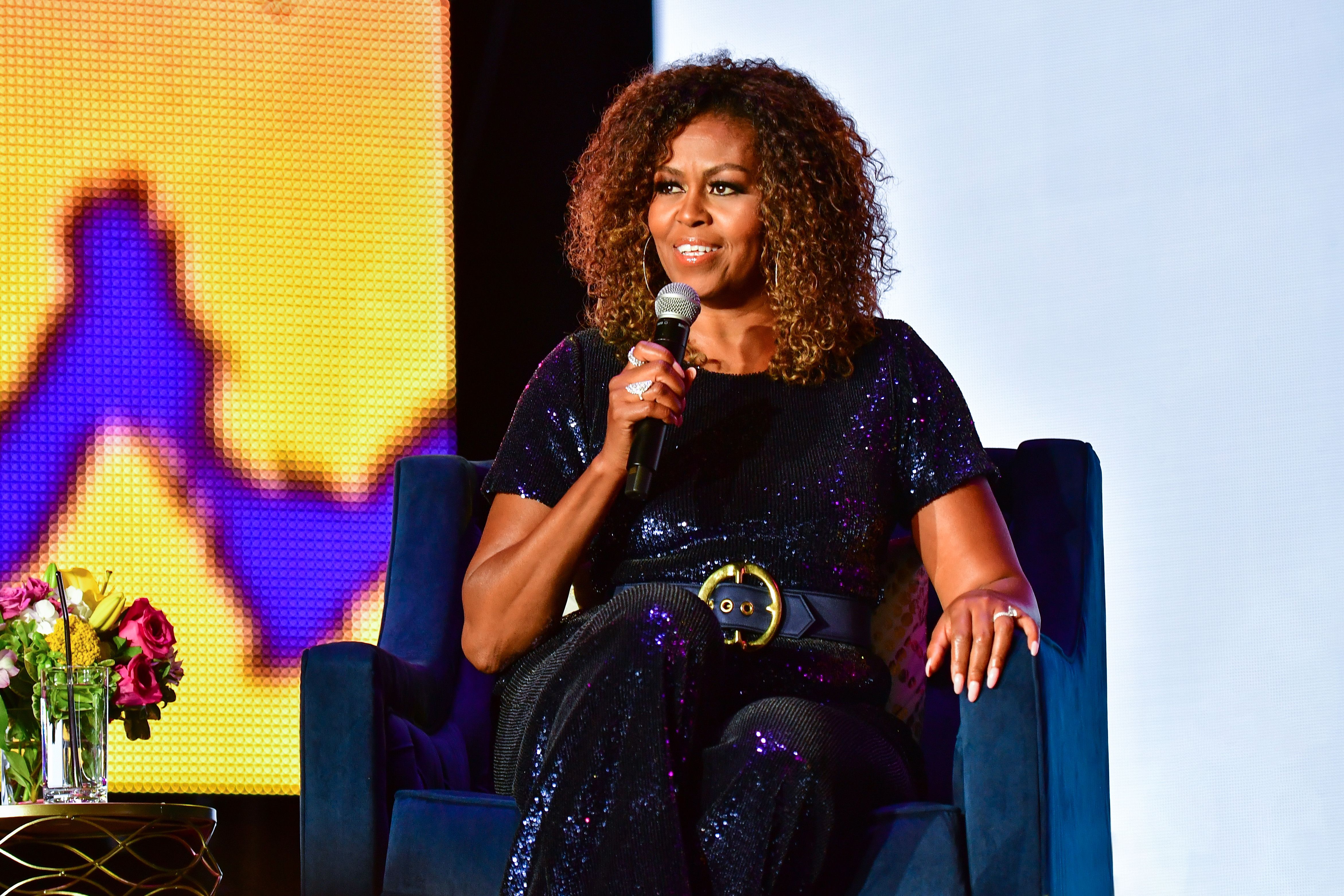 Michelle Obama on stage at the 2019 ESSENCE Festival at the Mercedes-Benz Superdome on July 06, 2019 | Photo: Getty Images 