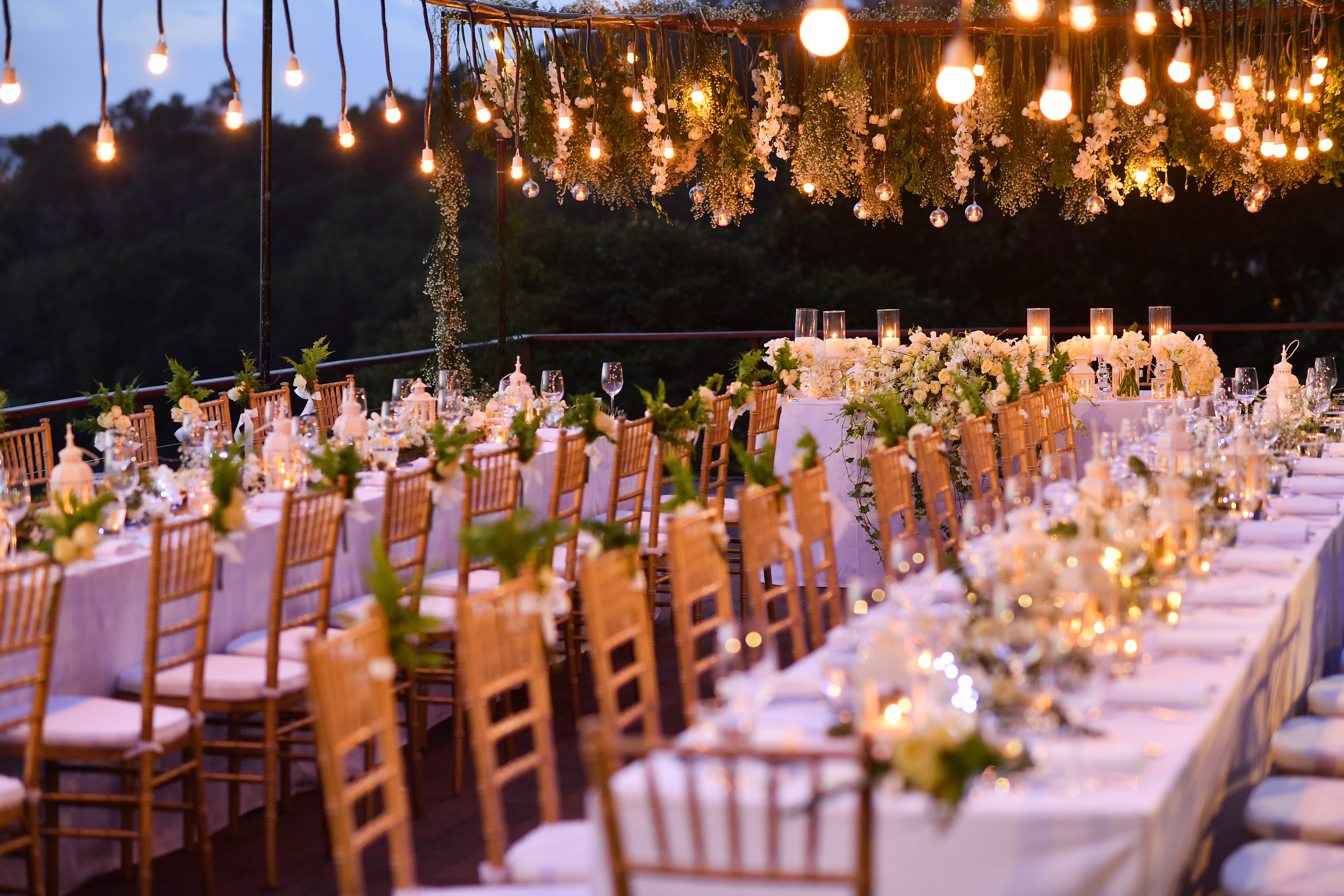 A wedding reception set with dinner tables and flowers | Source: Shutterstock